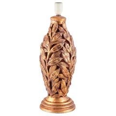 Grande lampada da tavolo in ceramica italiana. A forma di rami con decorazioni dorate.