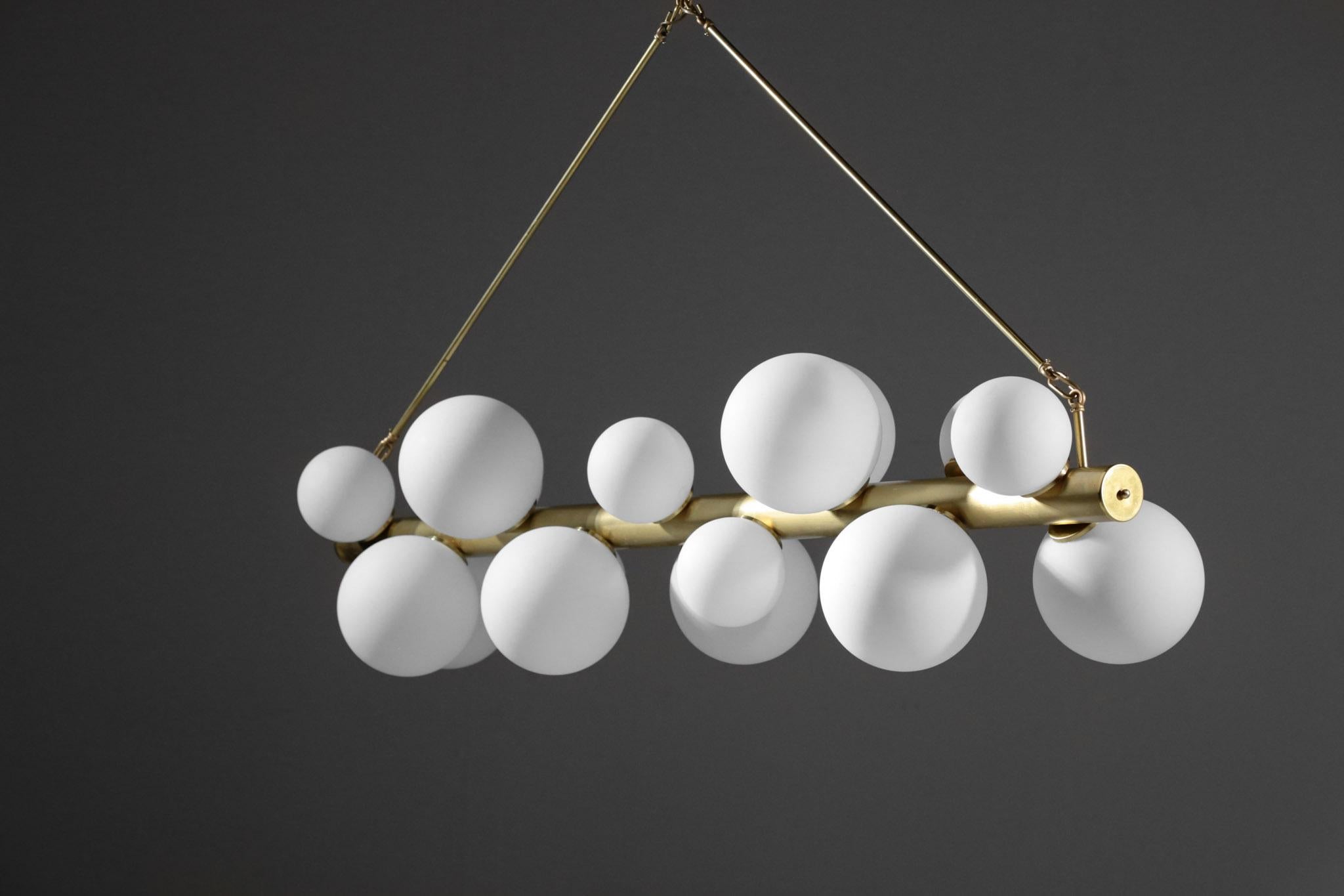 Beautiful modern chandelier Stilnovo style, structure in brass and alu with opaline light. Composed of 18 globes.
Artisanal work.
Bulb E14.
Great quality work

Custom on request.