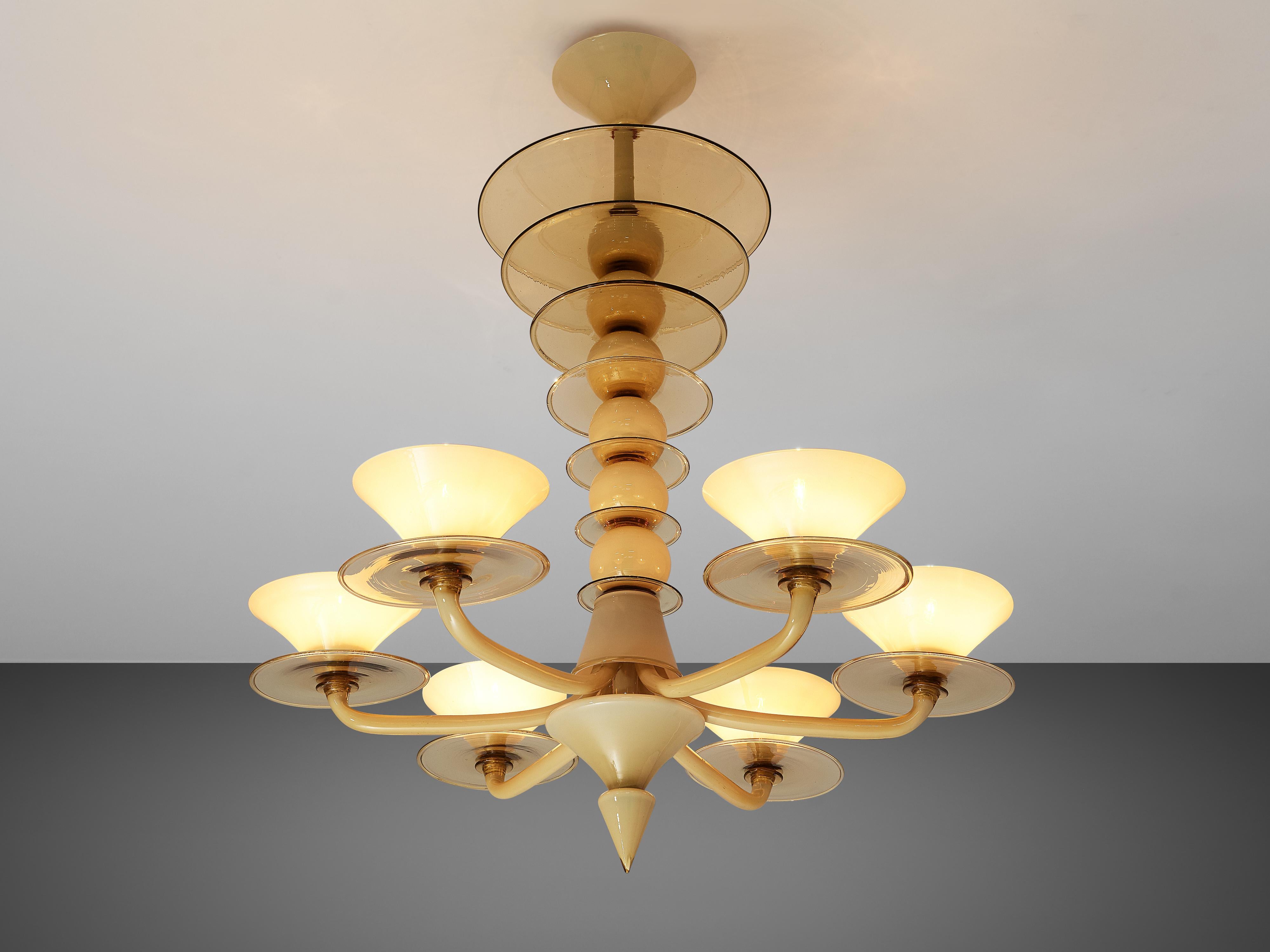 Chandelier, glass, metal, Italy, 1960s

This playful yet elegant chandelier convinces the viewer with beautiful color shades of yellow and beige. On a conical fixation are hanging six balls separated with plates in smoked glass. The plates get