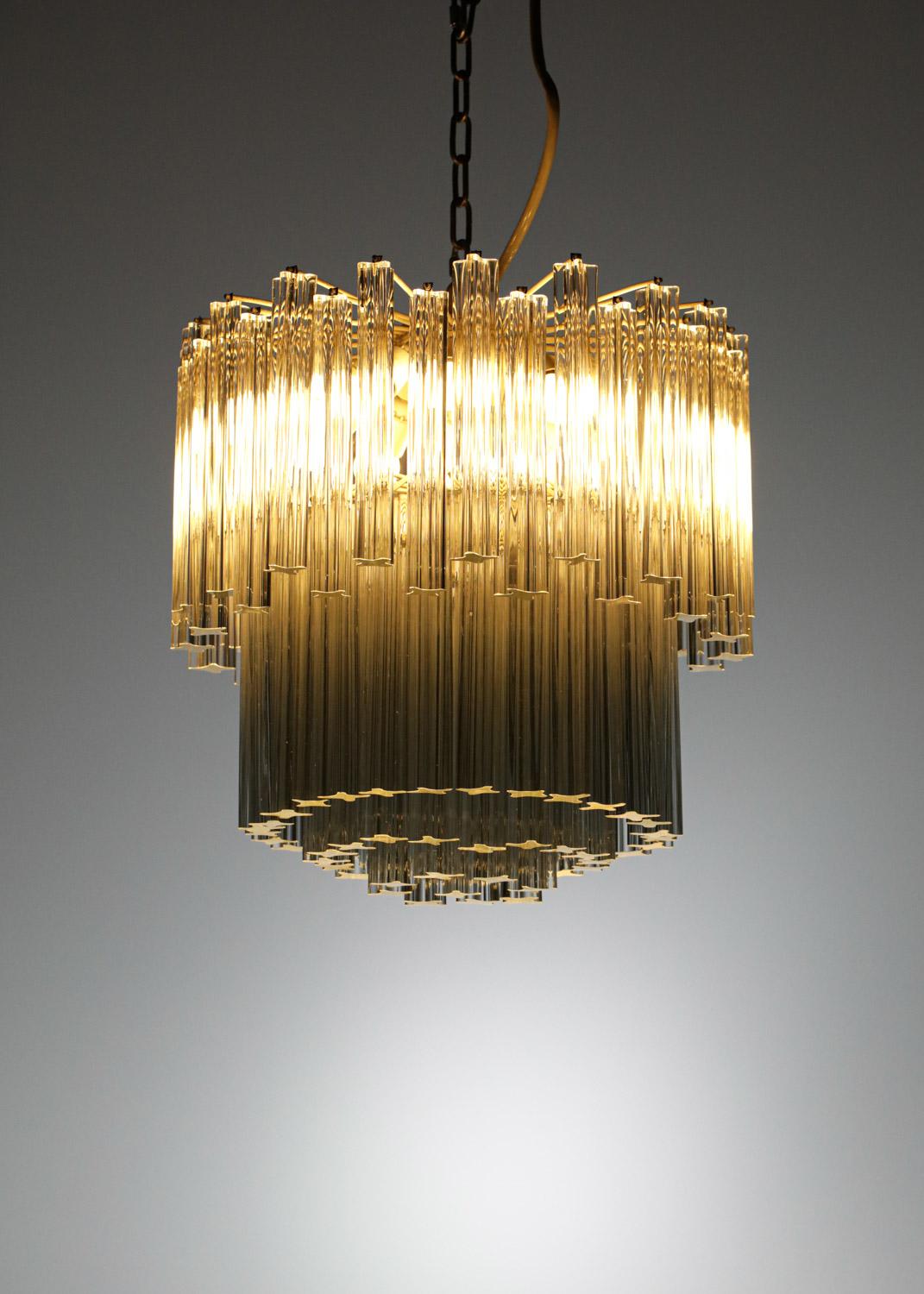 Sculptural Italian chandelier from the famous house Venini dating from the 40/50s. Structures in white lacquered metal (original paint) and rectangular diffusers in transparent Murano glass. Very nice vintage condition, slight traces of use and time