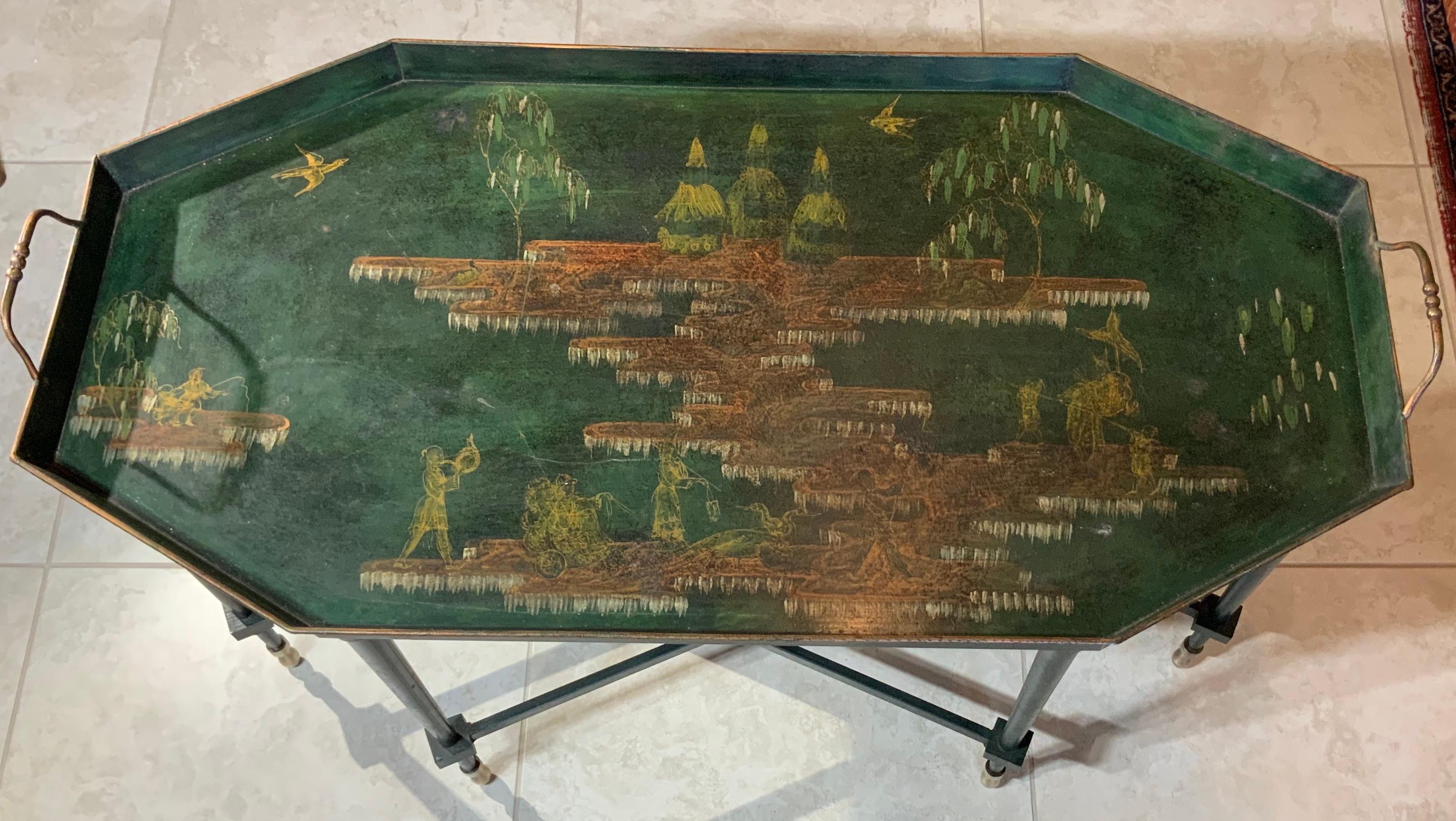 Italian chinoiserie tray table. Vintage Italian hand painted tole tray on custom made painted metal stand in rich green, gilt and gilt paint with Oriental dignitaries, pagodas, willows and cranes amidst gold -orang pools and meandering river. Very