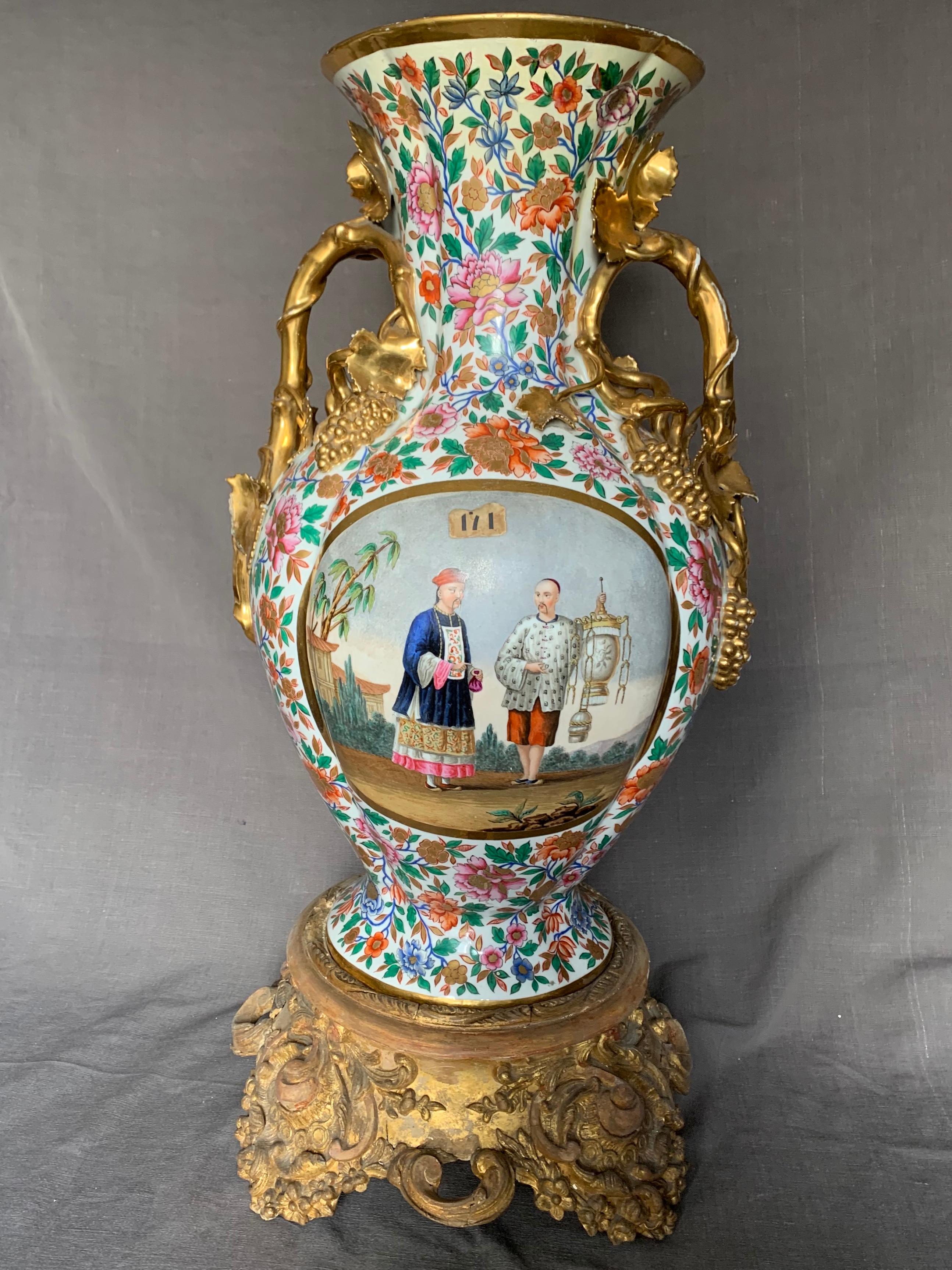 Large Italian chinoiserie vase. Monumental and rare Giovanni Poulard Prad floral and gilt-painted vase with all over floral ground scrolling gilt grape leaf handles centering two different chinoiserie views of gentlemen, on a gilt gesso and wood