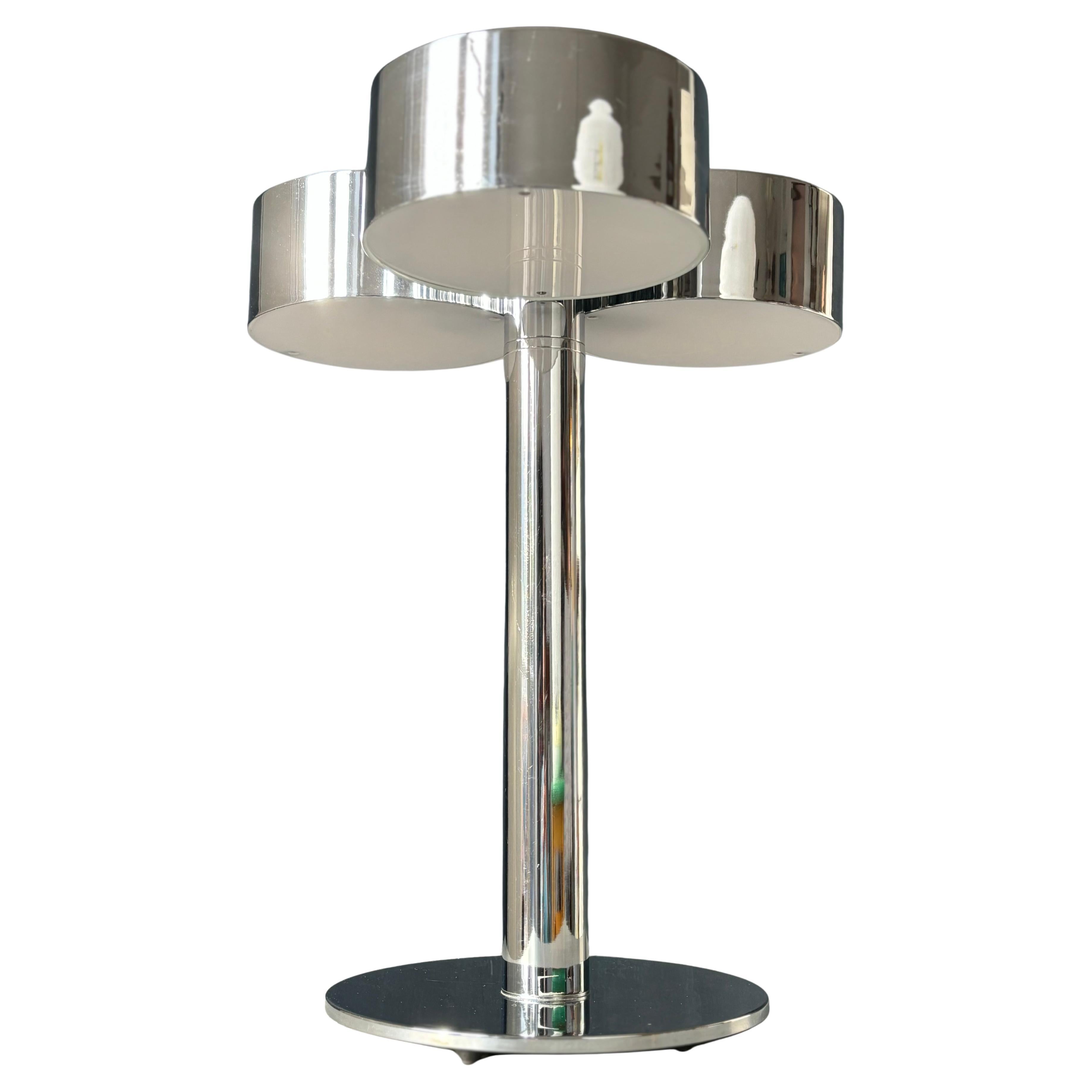 Large Italian modern architectural art deco style shiny chrome table lamp with three light sources. 
Wired for EU and US use with black cord with switch and Scandinavian plug.
Italy, 1970s.