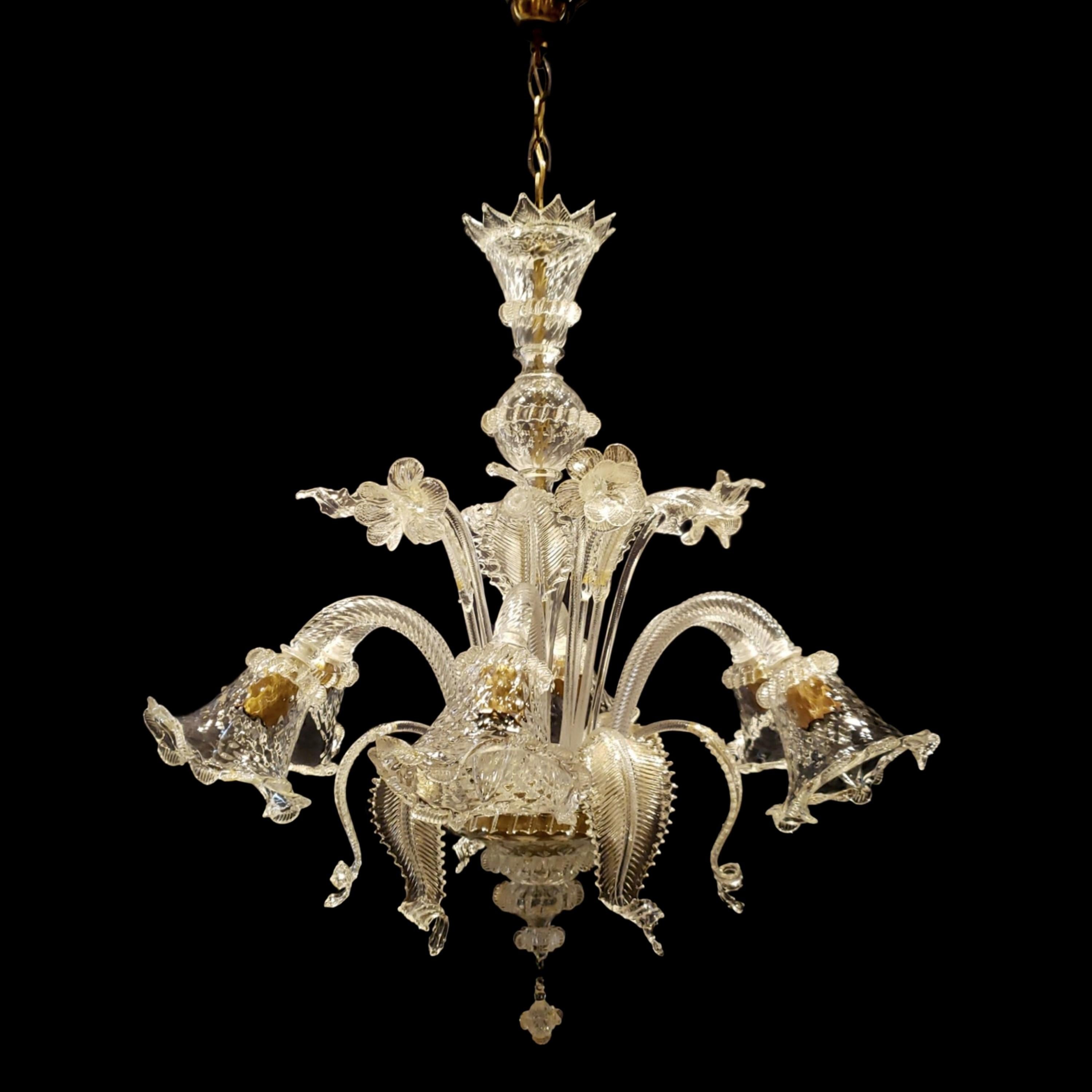 Large clear hand made glass six arm Italian Murano chandelier with quilted down light shades and up and down leaves with flowers. This comes rewired and ready to install. Ships disassembled.  Cleaned and restored. Please note, this item is located
