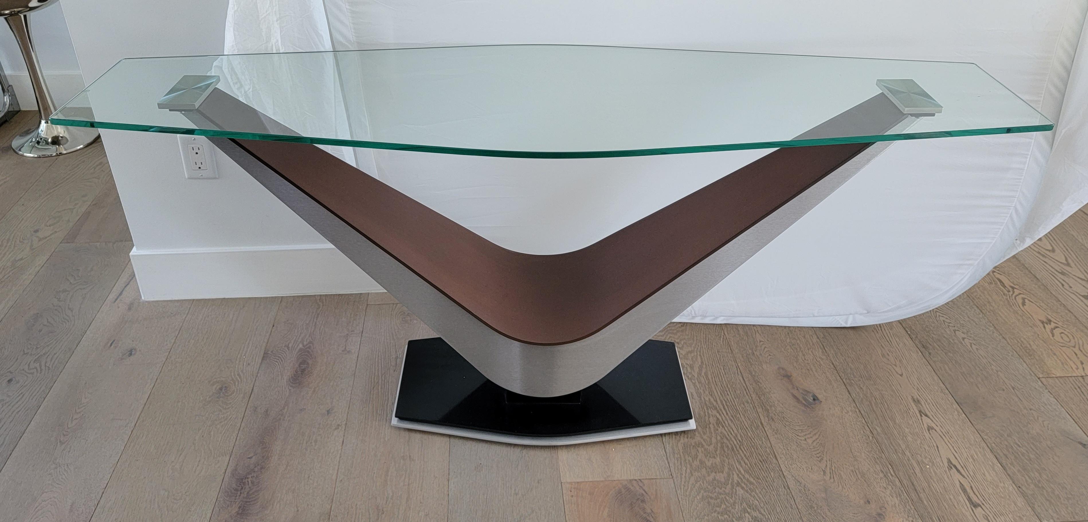 Large Contemporary modern console table with thick glass and a chrome and wooden frame. The chrome block accents hold up the glass and are visible through the top of the table. Very strong and sturdy piece.