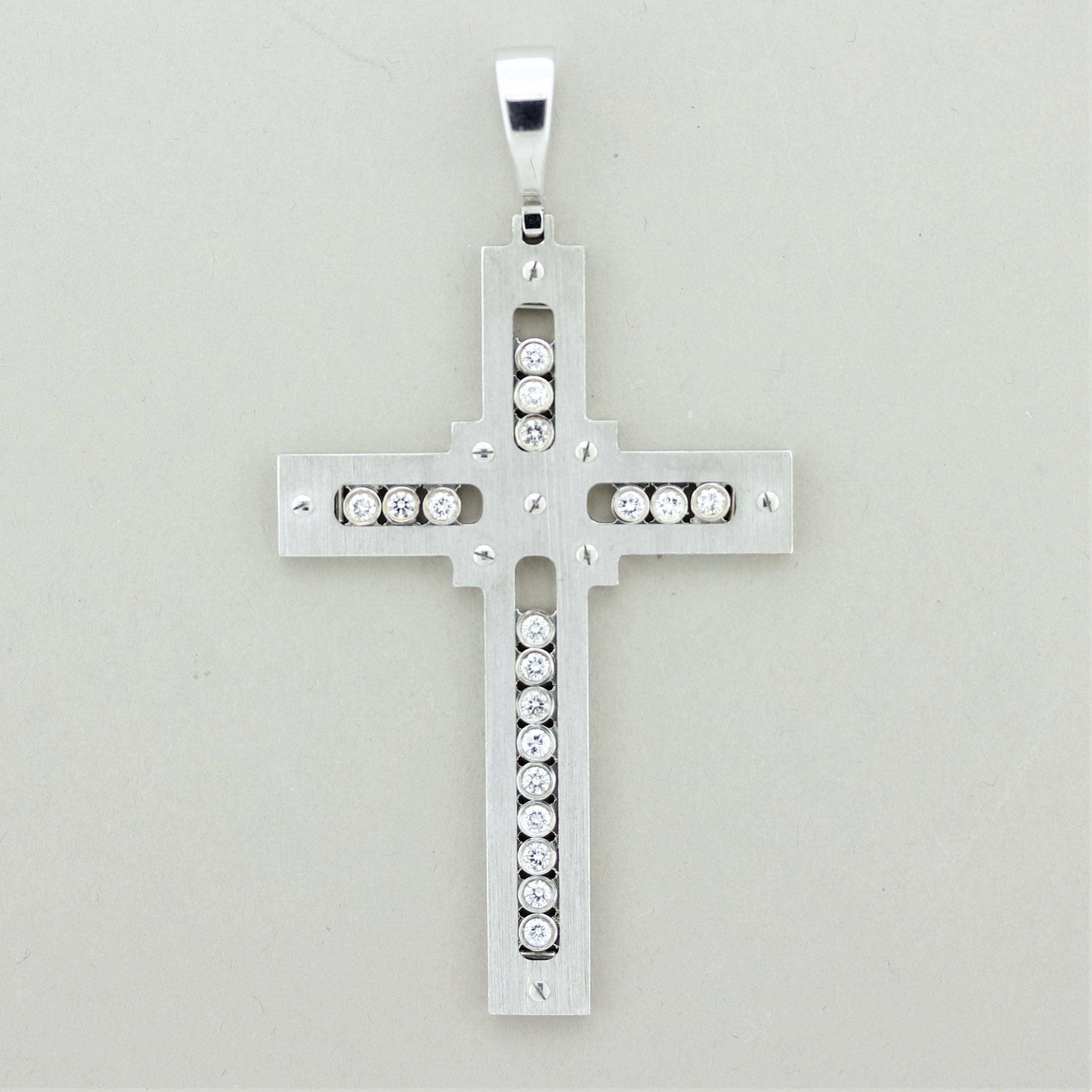 A large gold cross featuring 18 round brilliant-cut diamonds which are bezel-set in slides that move freely one from another (totaling 1.48 carats). Made in Italy, the quality of the craftsmanship is clearly seen. Made in 14k white gold with a