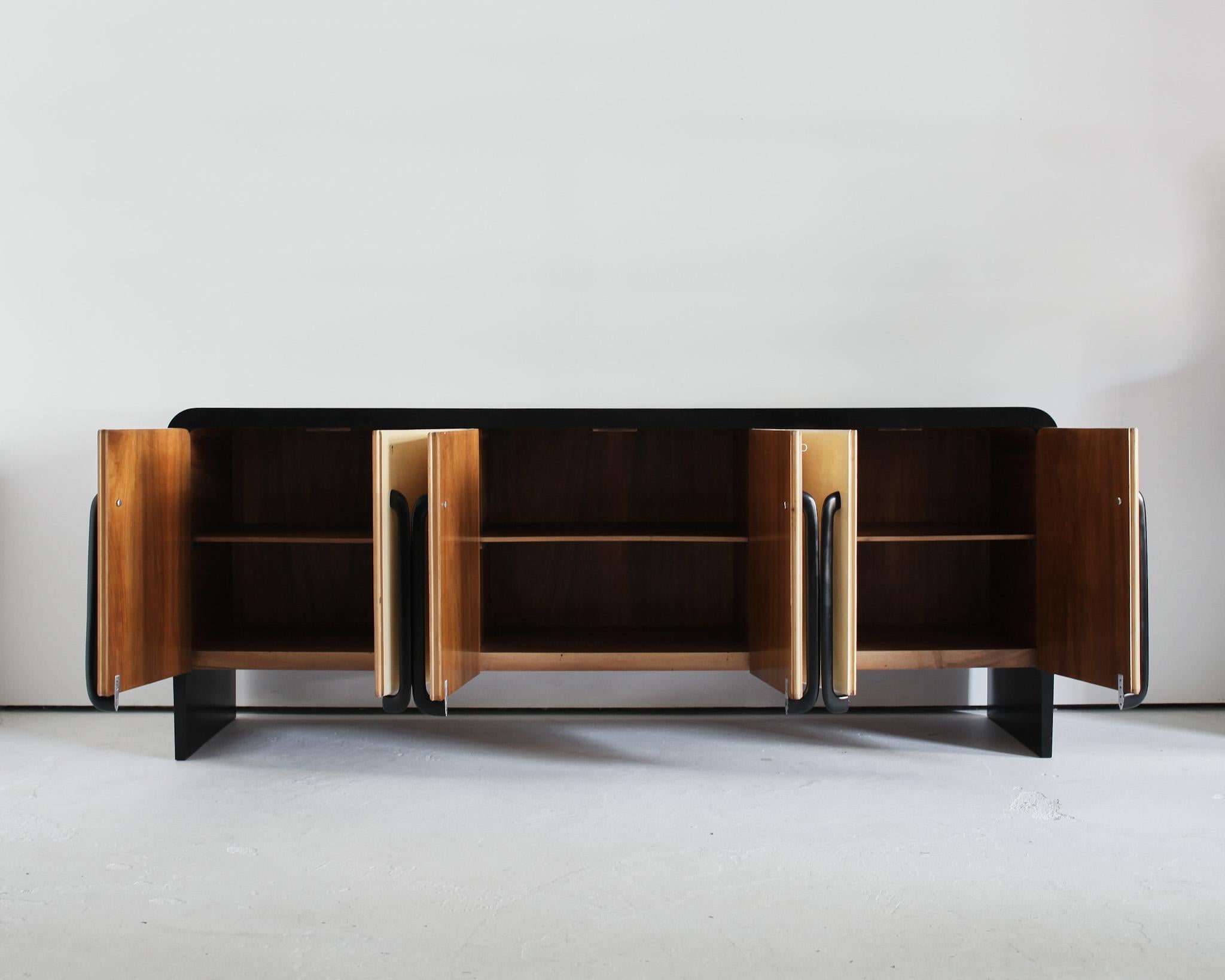 A very large and striking ebonised Italian sideboard with vellum clad doors.

Beautifully constructed with three lockable compartments, each with one interior shelf.

Believed to be the work of Italian designer/architect Guglielmo Ulrich.

In