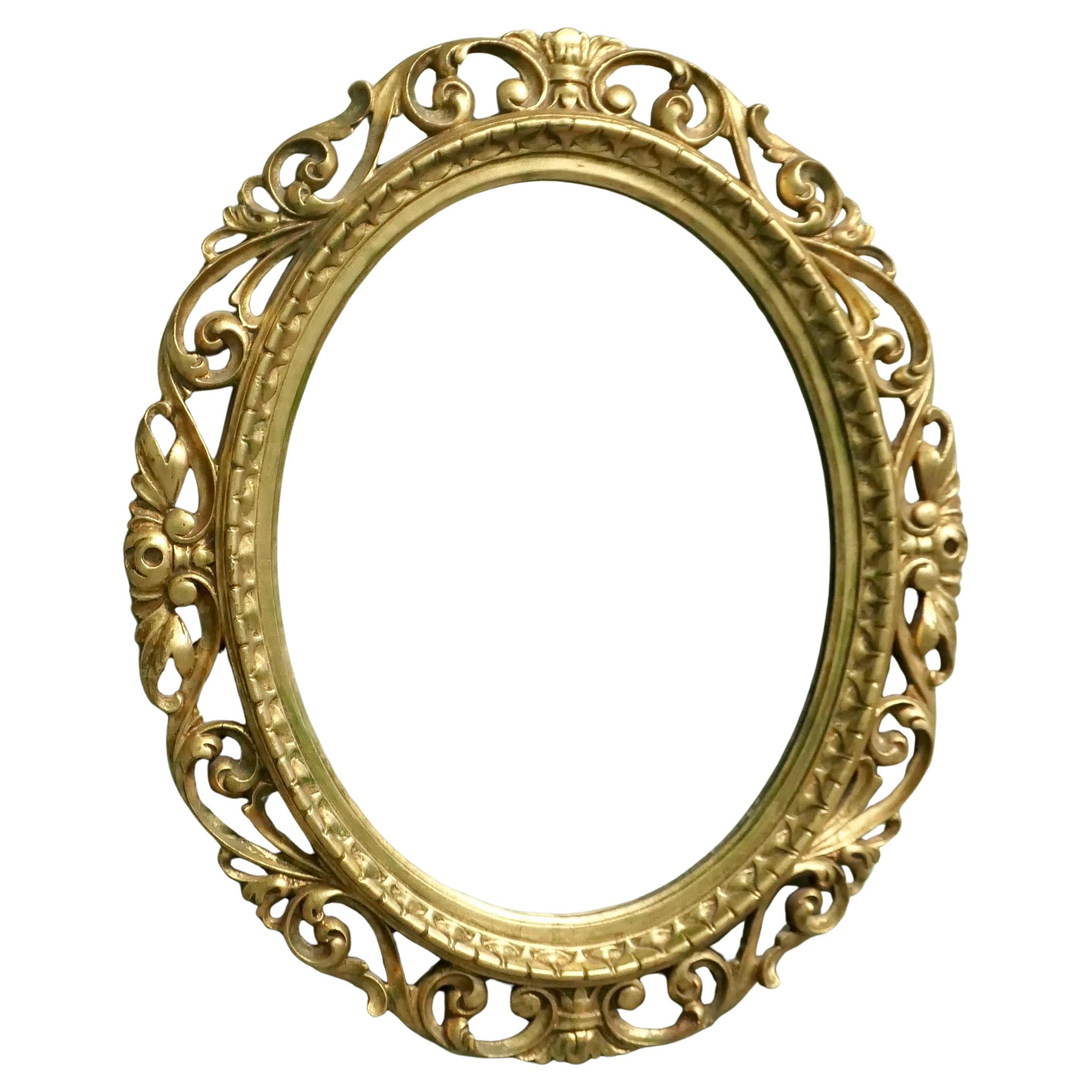 Large Italian Decorative Gilt Oval Mirror For Sale