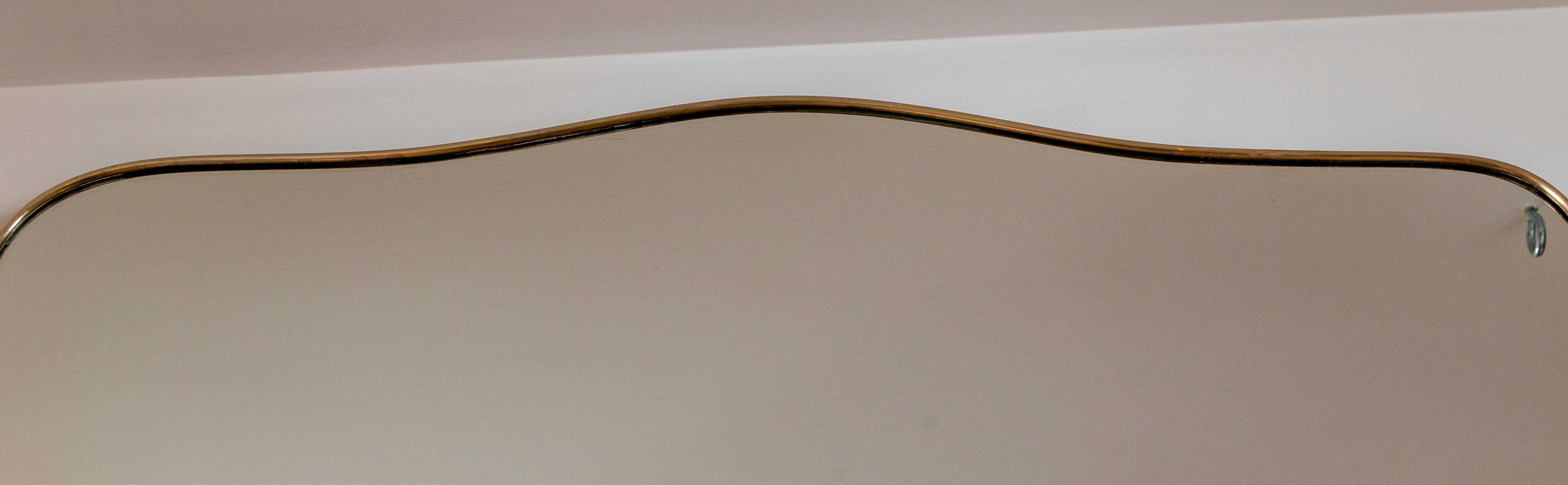 Late 20th Century Gigantic Italian Design Brass Shield-Shape Mirror For Sale