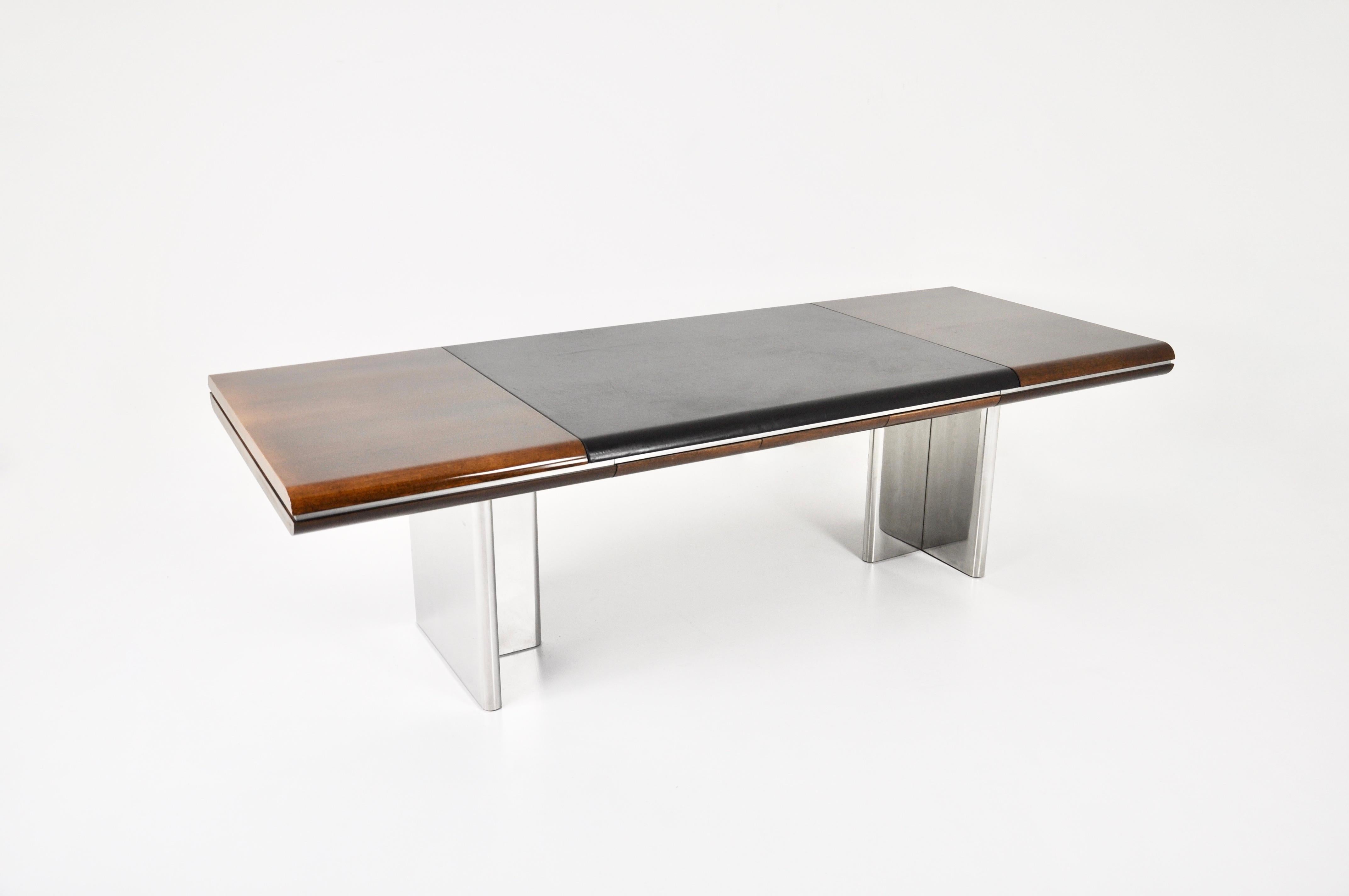 Desk with leather and wood top and chromed metal legs designed by Hans Von Klier in the 70s. 
Wear due to time and age of the desk.