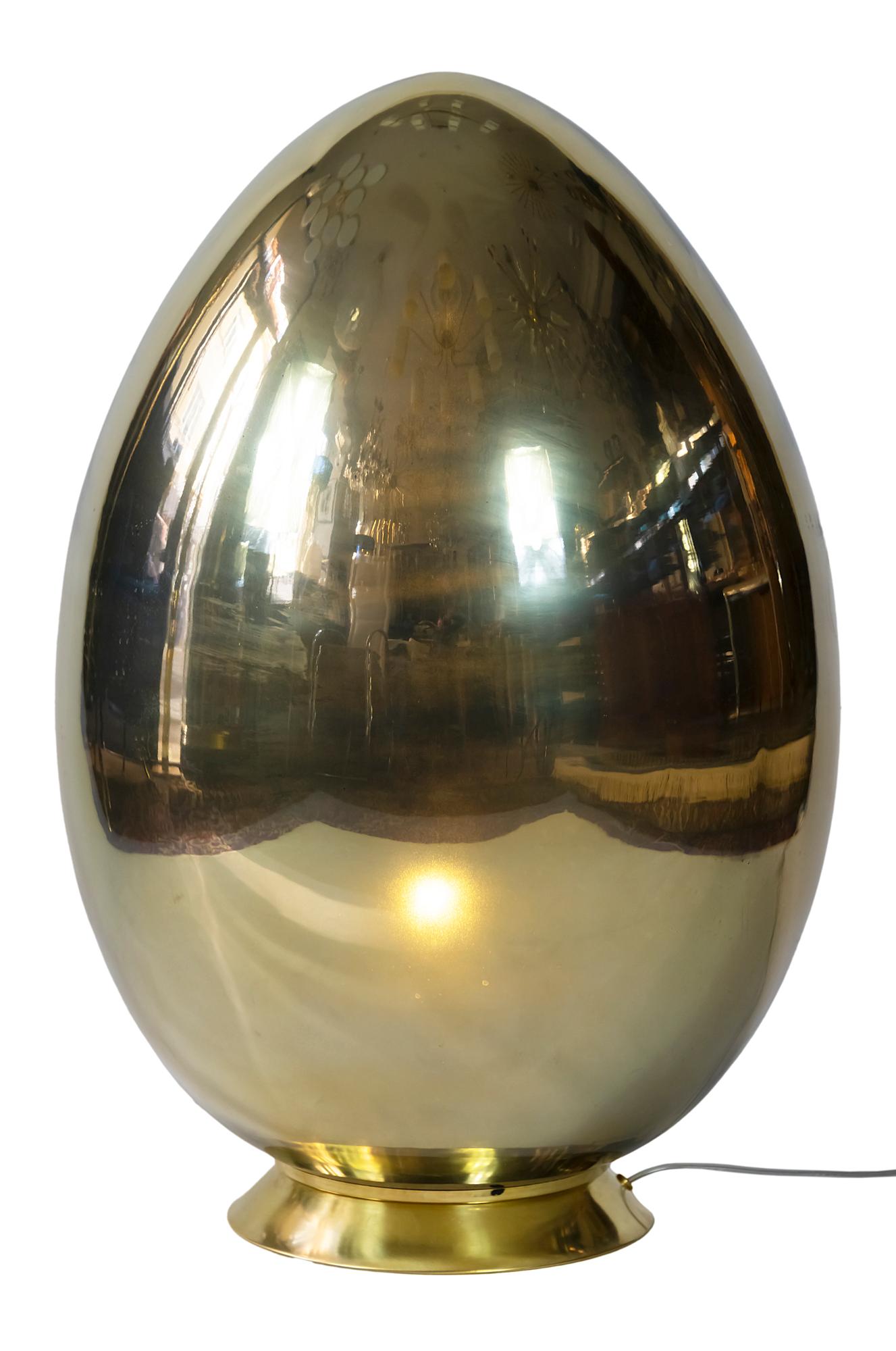 Large Italian table lamp with brass base and gold color glass shade in the egg shape.
Inside is a bulb E27.
  