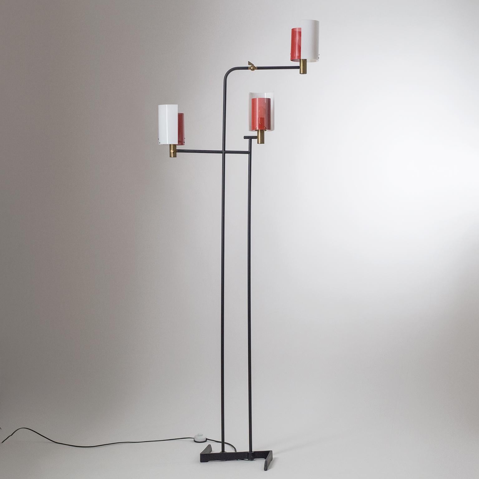 Rare large Italian three-arm floor lamp from the 1950s. Very unique modernist and sculptural design with black lacquered steel/iron structure and diffusers made of brass, acrylic and red perforated steel. Each arm has an original brass E14 socket