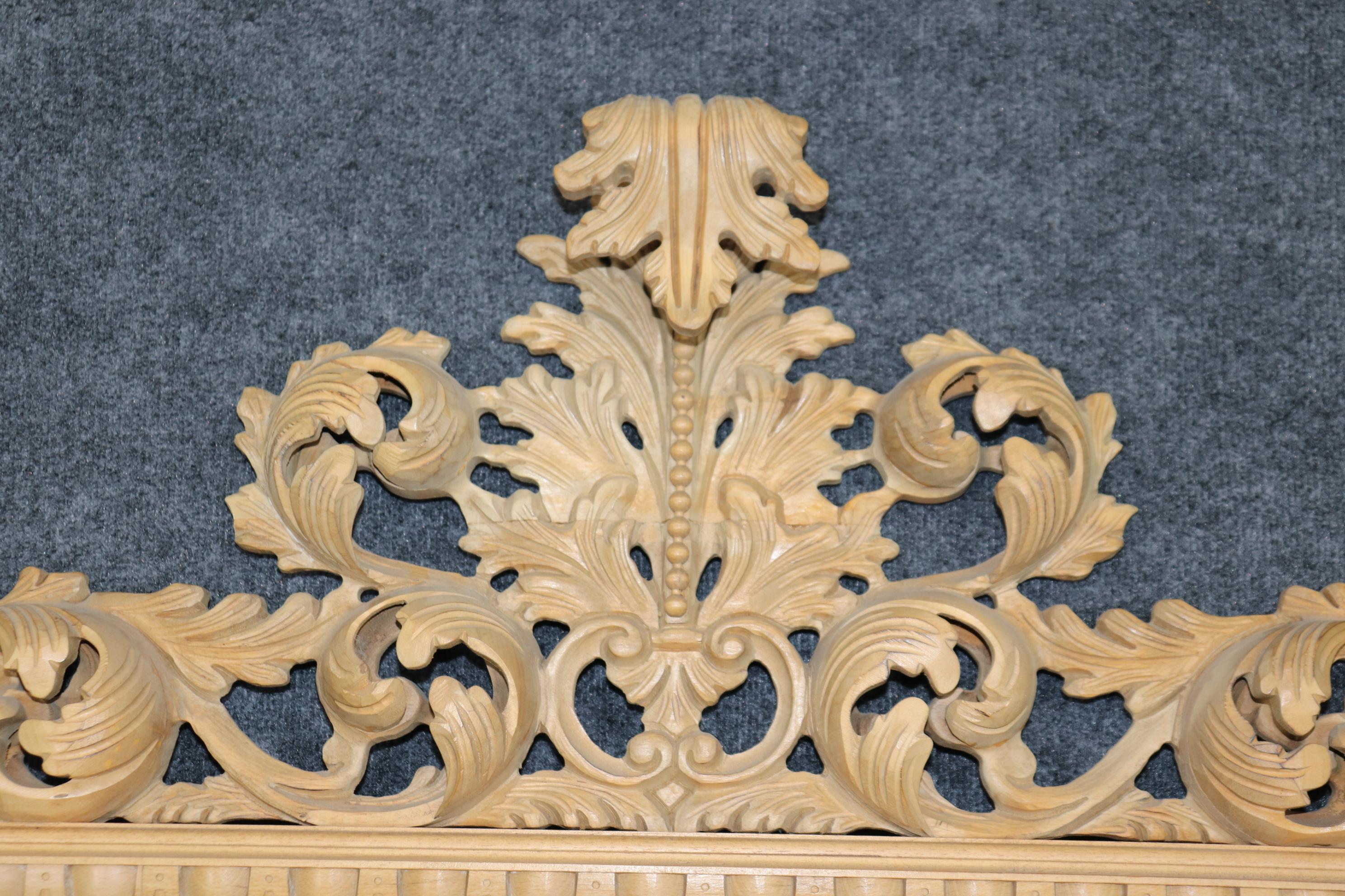 This mirror is reminiscent of the finest Italian Carved Florentine or Rococo carved pine mirror. The carving is very detailed and precise and yet the selection of pine as the material suggests a less portentous presentation where you want the