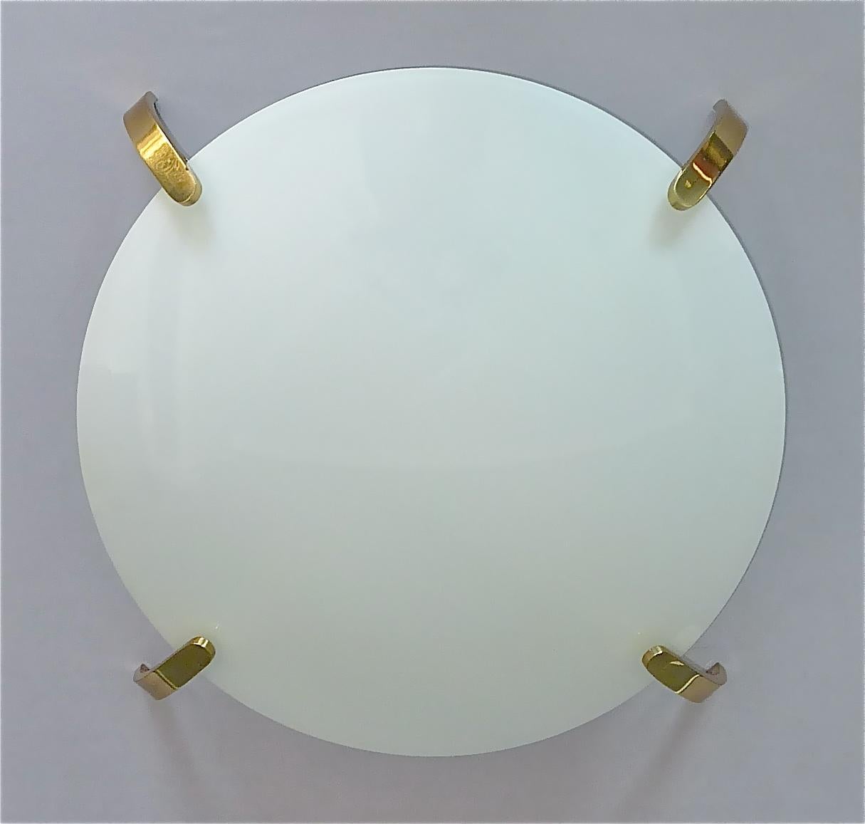 Large Italian midcentury white glass combined with patinated brass flush mount executed in the 1950s with attribution to one of the famous companies and designers Angelo Lelii for Arredoluce, in the style of Stilnovo or Kalmar. The ceiling lamp is