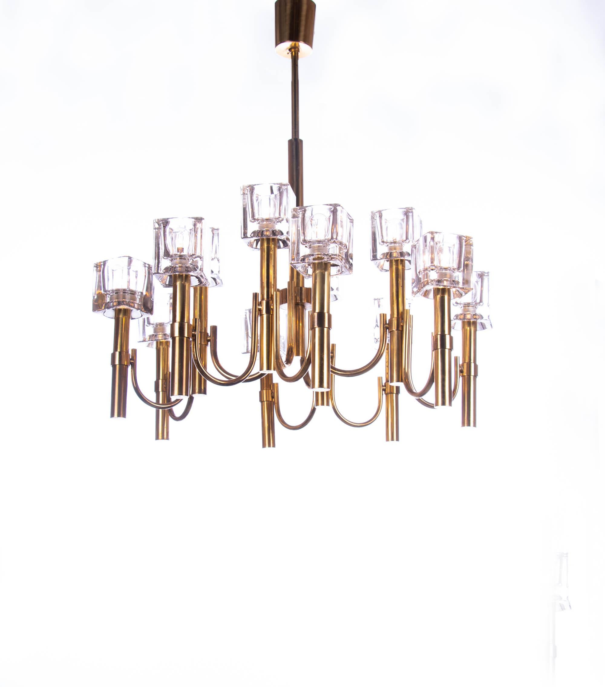 Elegant chandelier with twelve glass cubes on a brass frame. Chandelier illuminates beautifully and offers a lot of light. Designed by Gaetano Sciolari, Italy in the 1970s. 

Design: Gaetano Sciolari. 
Style: mid century, modernist. 
Materials: