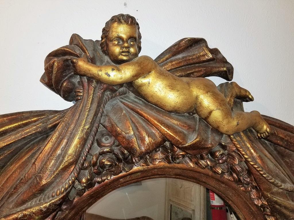 large cherub mirror