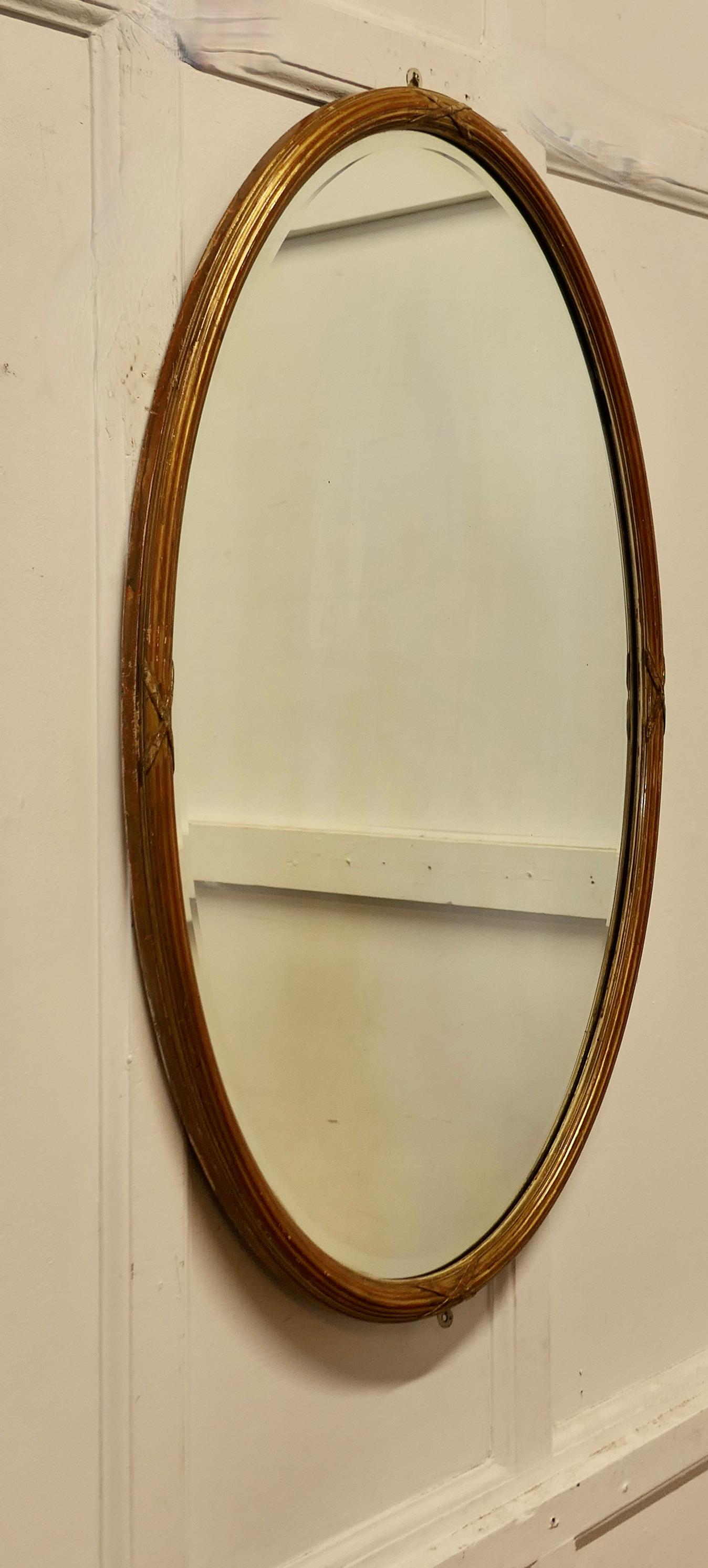 19th Century Large Italian Gilt Oval Mirror