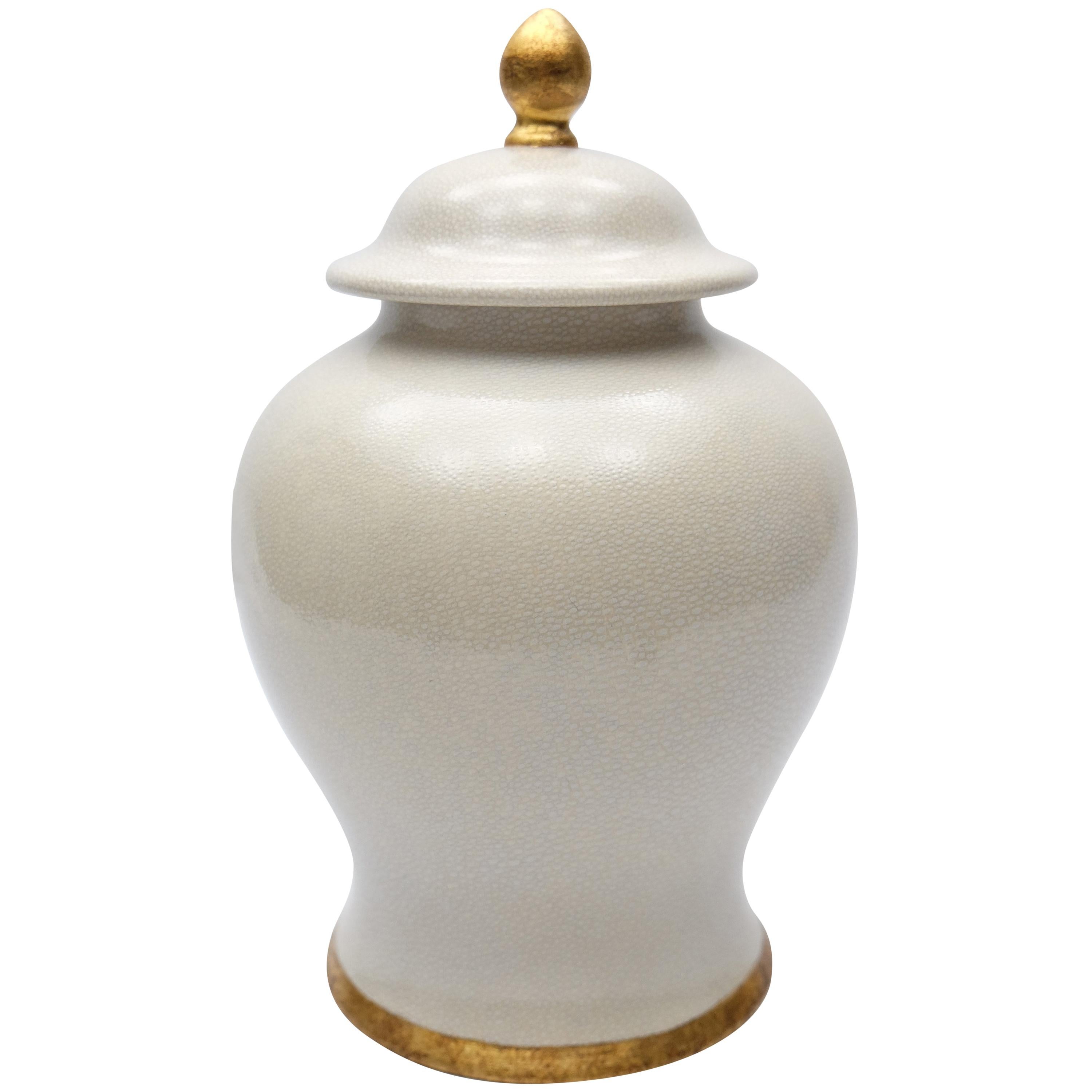 Paolo Marioni Large Italian Glazed Ceramic Jar with Gold-Leaf Accents

Offered for sale is a large glazed ceramic lidded ginger jar by Paolo Marioni. The jar has a subtle crazed-glaze finish and is accented in gold-leaf. The jar is signed on the