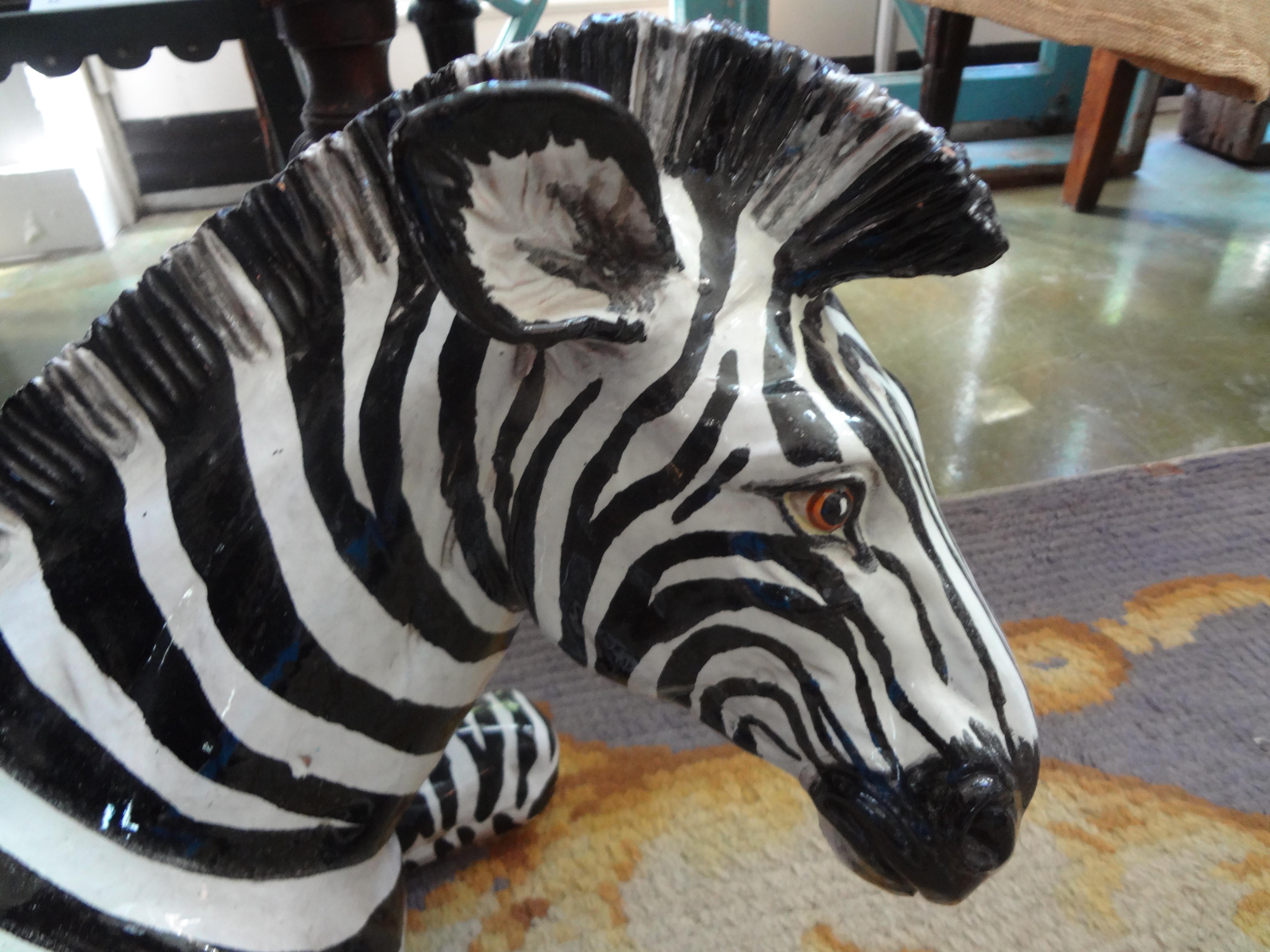 Monumental Italian glazed Terracotta zebra figure.
Stunning extra large vintage Hollywood Regency well detailed Italian glazed terracotta black and white reclining zebra figure or statue. This beautifully executed midcentury Italian glazed zebra