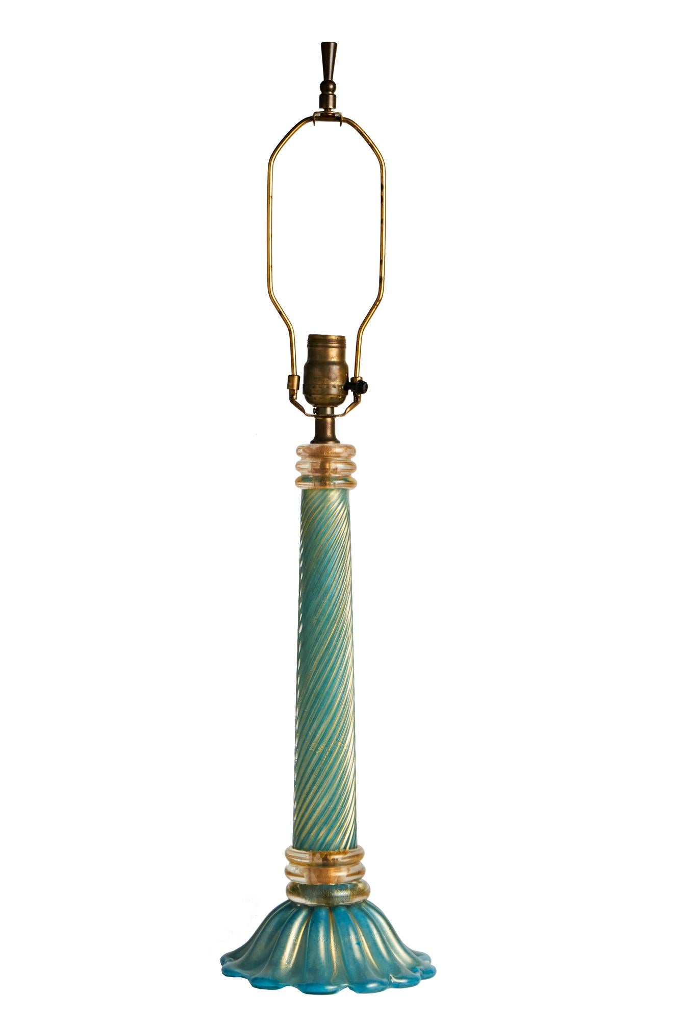 This stunning tall Italian Mid Century, Murano glass table lamp is by Barovier & Toso and features the Coronado d'Ore technique whereby the rare green glass colorway is highlighted with gold inclusions, Its foliate base is capped with three rings of
