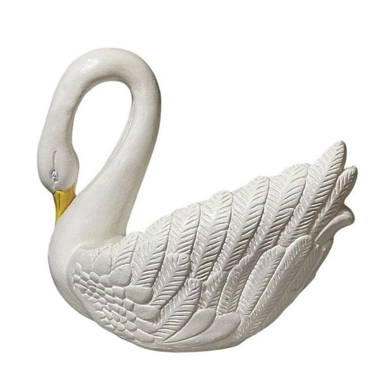 A very large Italian ceramic swan tureen, centerpiece, or planter. This lovely Hollywood Regency piece is from Italy and hand-painted in a lovely creamy white. The inside is hollow, and the beak and eyes are painted with an ever-so-soft blue and