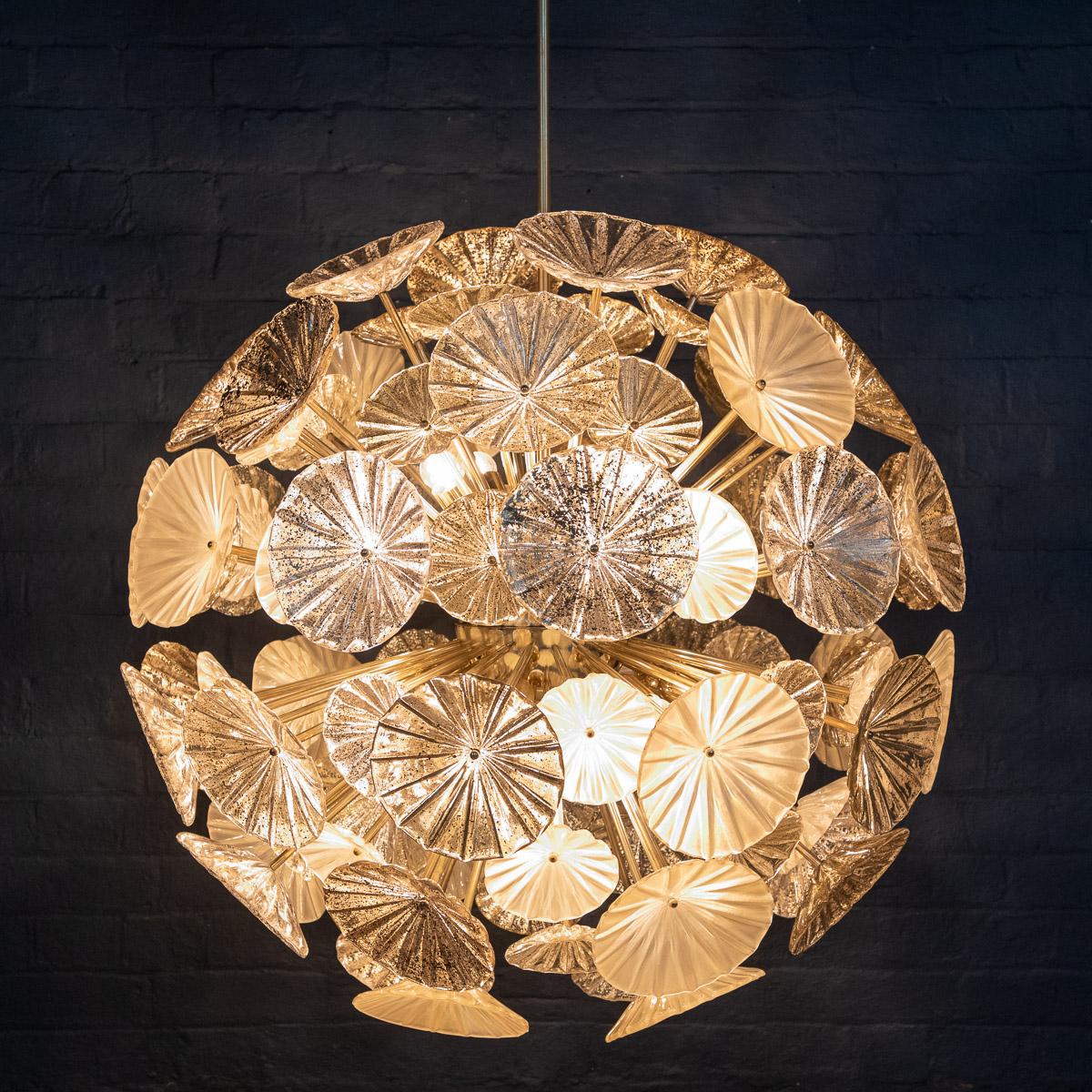 Very large Venetian handmade chandelier, inspired by 1950s “Sputnik“ models, made with glass daffodil shaped glass in opaline and clear glass with silver and gold leaf flecks, made in a very limited number in Venice, Italy. 110 brass rods supporting
