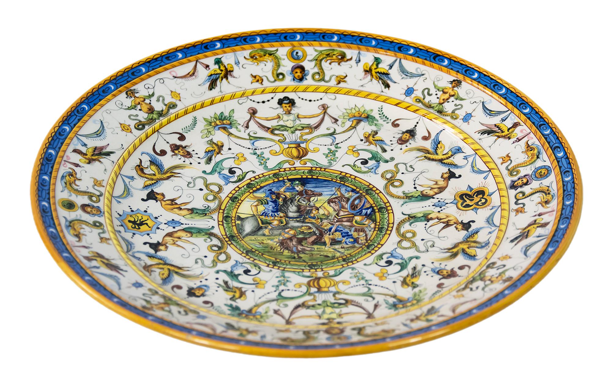 Italian Majolica plate with hand painted decor.
  