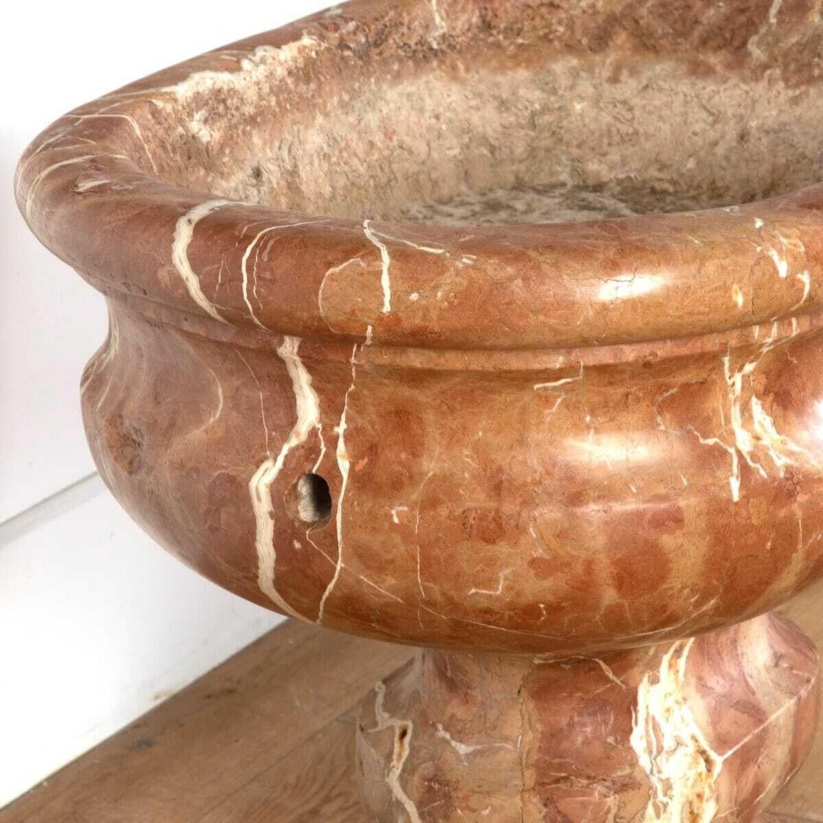 18th century Italian cistern of large scale and carved from Verona marble.
Classical ovoid shape with a dished centre and ogee-shaped body, raised on a waisted socle.
This cistern exhibits the wonderful earthy colors of Verona marble.
Wonderful