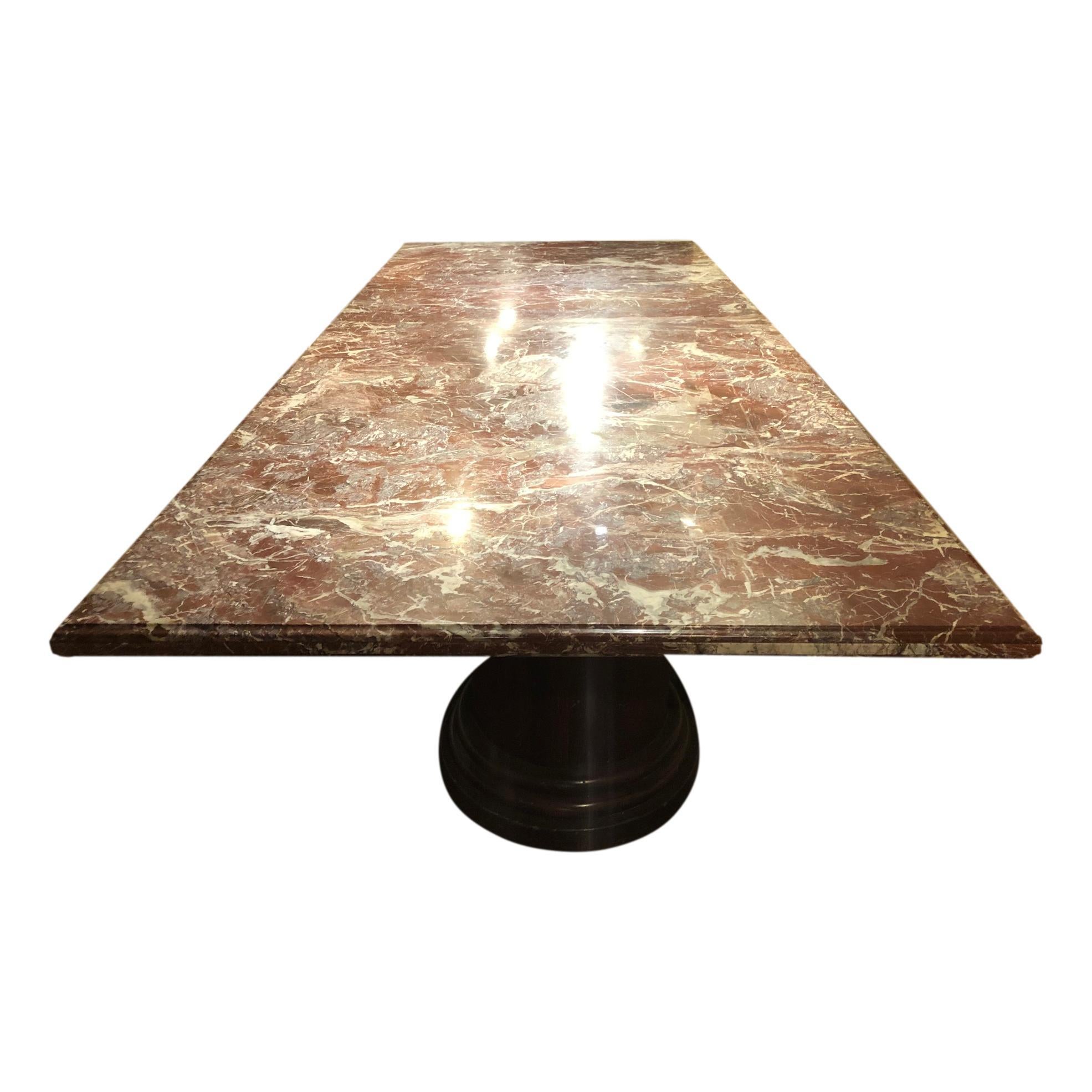 A large circa 1970's Italian conference table with red marble top in two parts that sit on the three pedestals bases. It is very sturdy and in great condition.

Measurements:
Height: 29.5