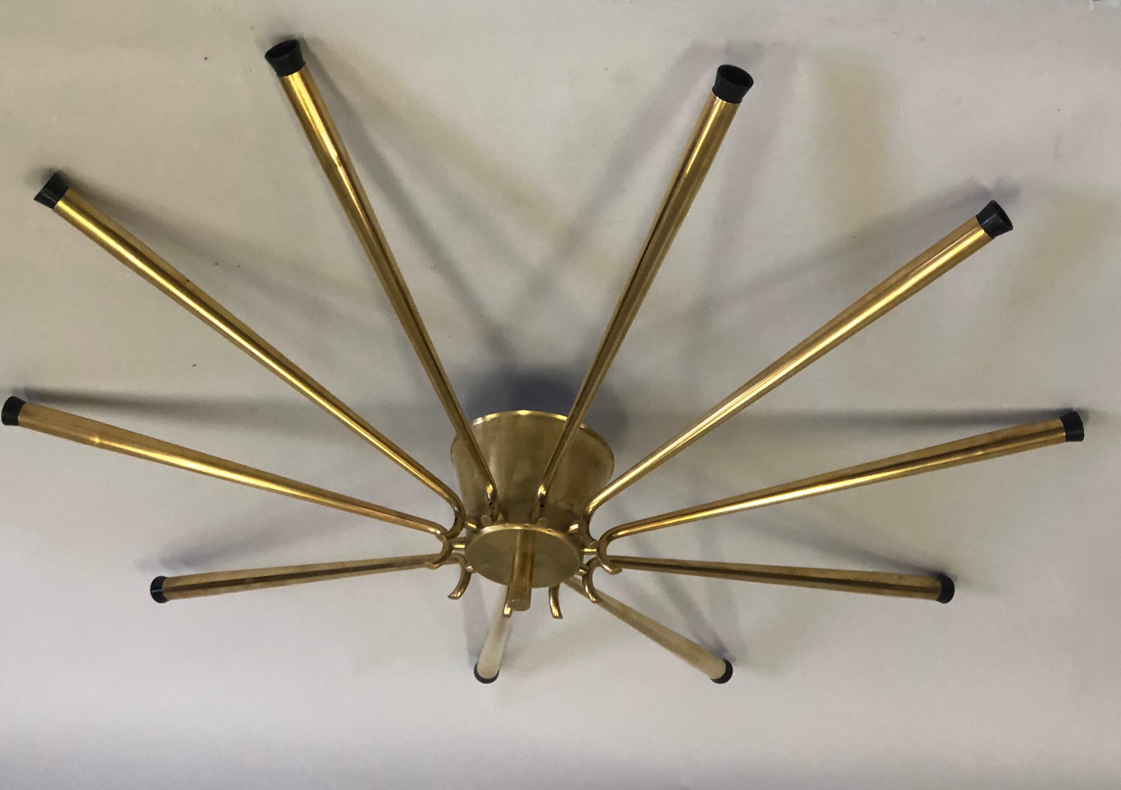 A very large Italian midcentury solid brass flush mount / pendant by Stilnovo in the form of a Star or Sunburst. 

This elegant, dramatic piece can flush mount or be suspended as a pendant. See photos for options.

Measures: Diameter without