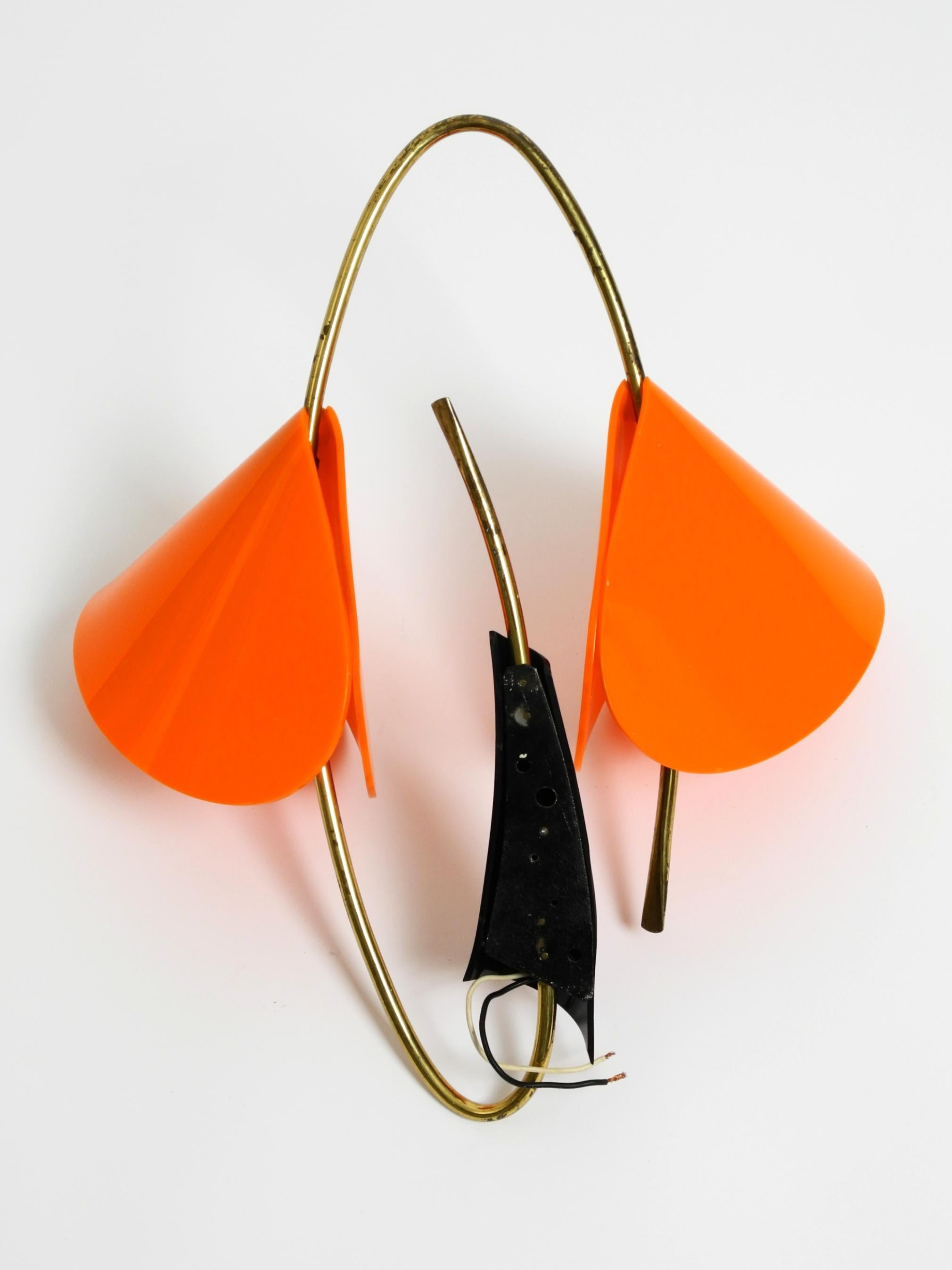 Metal Large Italian Mid Century brass wall lamp with orange acrylic glass shades For Sale