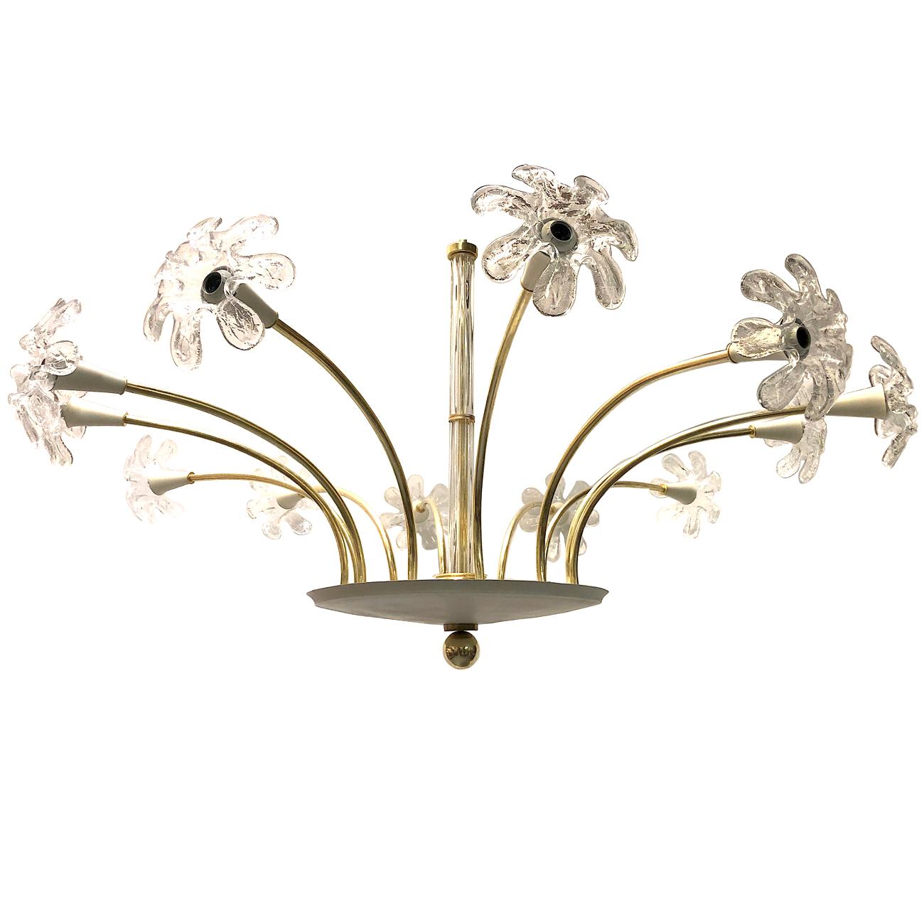 An Italian circa 1960s twelve-light painted and gilt bronze chandelier with large glass flowers and glass stem body.

Measurements:
Diameter 62
