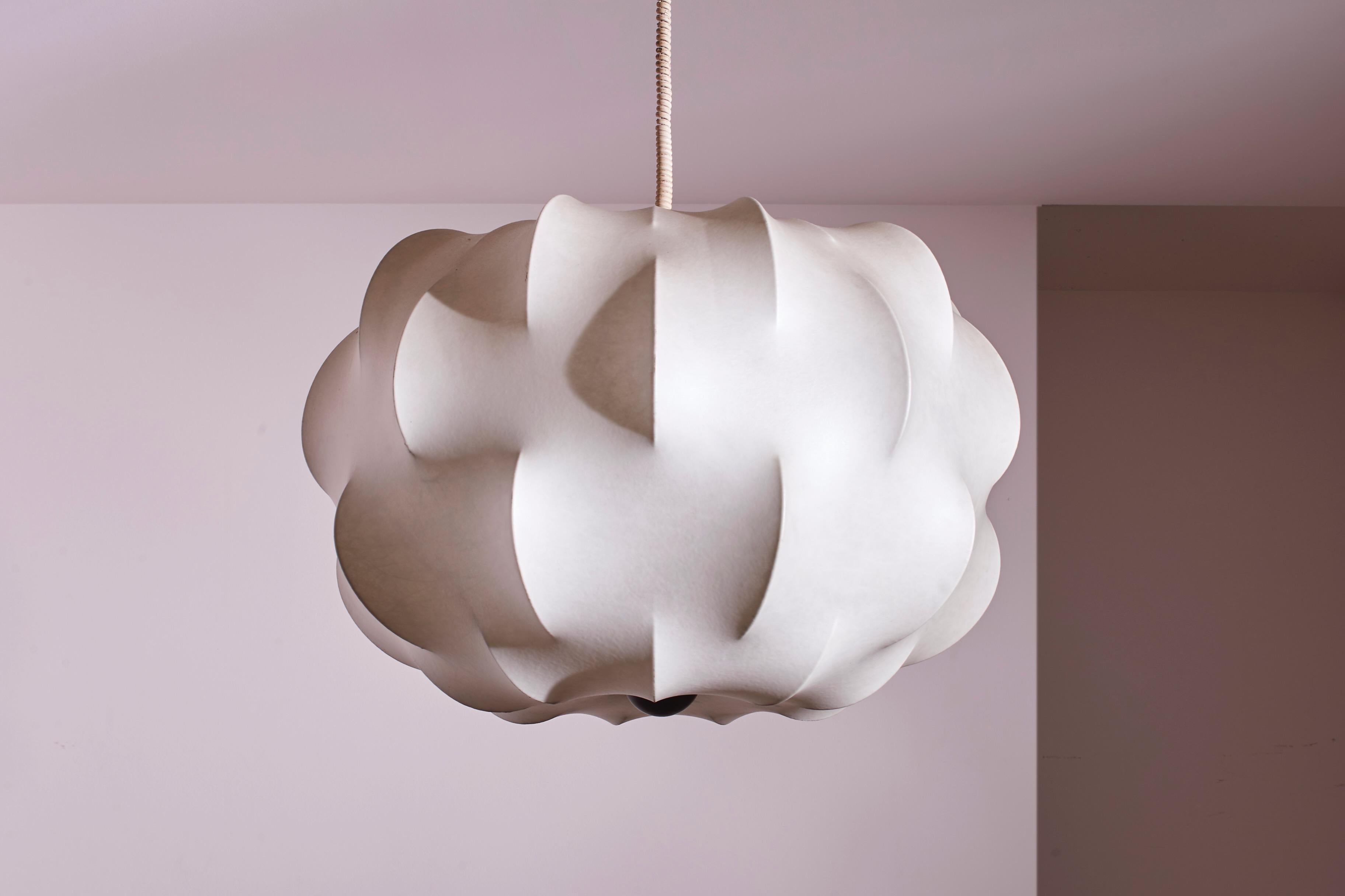 A large cocoon Nuvola chandelier by Tobia Scarpa for Flos designed in the 1962 and crafted in the early 1970s.

In the realm of mid-century modern design, few pieces encapsulate the era's essence quite like the Nuvola pendant light by Tobia Scarpa