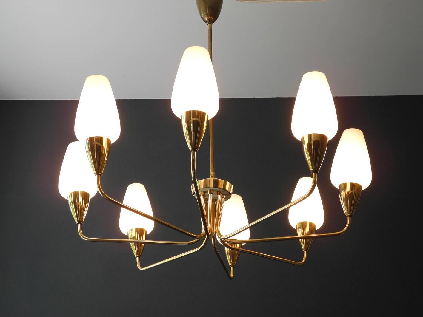 Great gorgeous midcentury brass chandelier from Italy.
Fantastic condition, with all original glass shades.
Great design with many details, very high quality made.
Very nice warm glare-free light with eight E14 sockets.
Complete lamp without