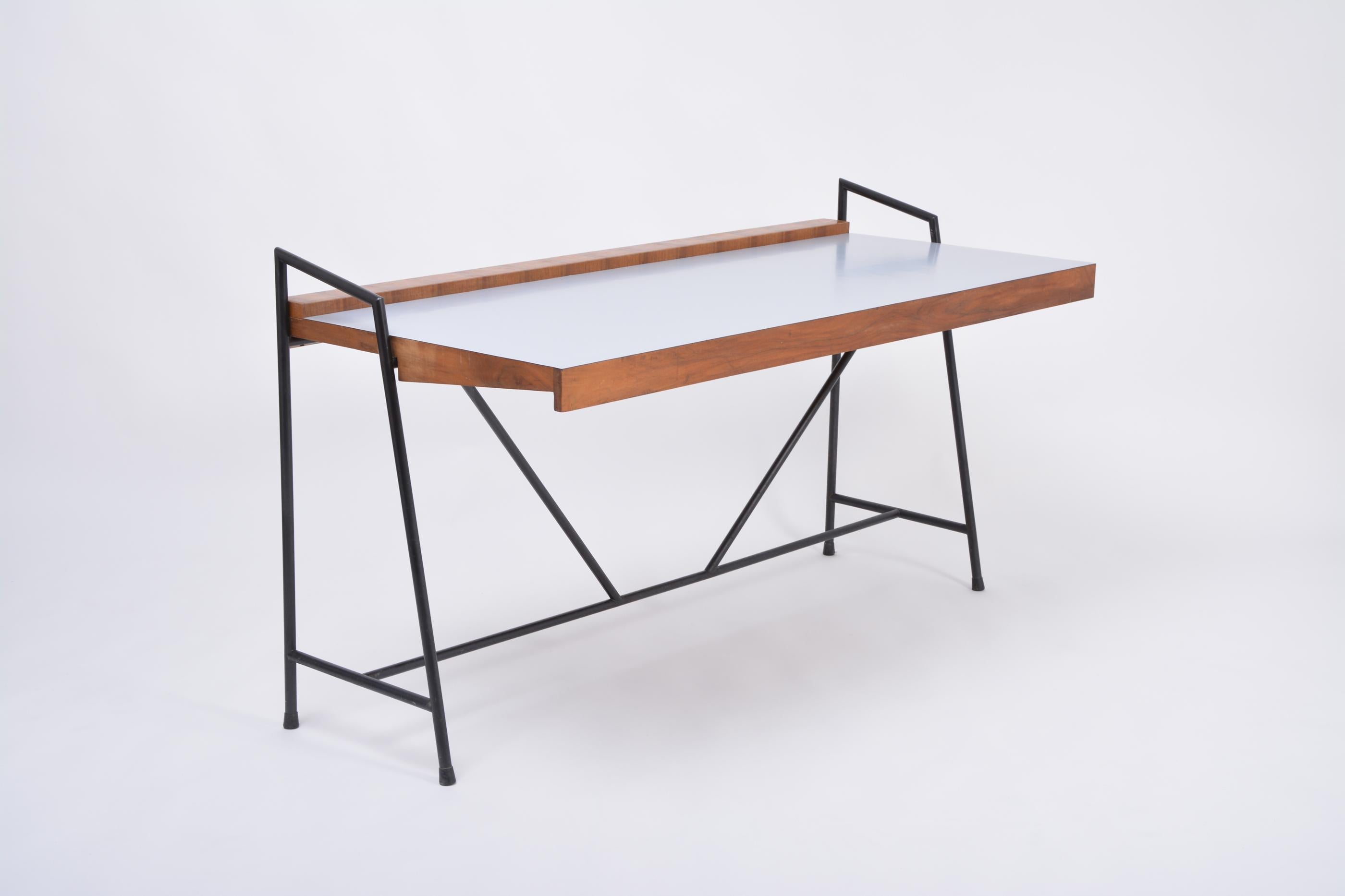 Large Italian Mid-Century Modern writing desk.
Spectacular large writing / working desk made in the 1950s in Italy. Clean-lined, elegant and simple structure made of lacquered steel with wooden desk covered in formica. Very lightweight. The top has