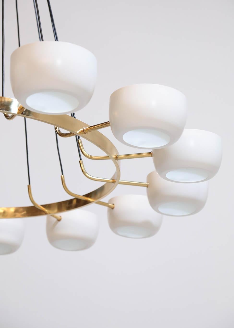 Beautiful modern chandelier Stilnovo style, structure in brass with opaline light. 
Composed of brass with metal lampshades and opaline glasses
14 lights, color of shades on request.