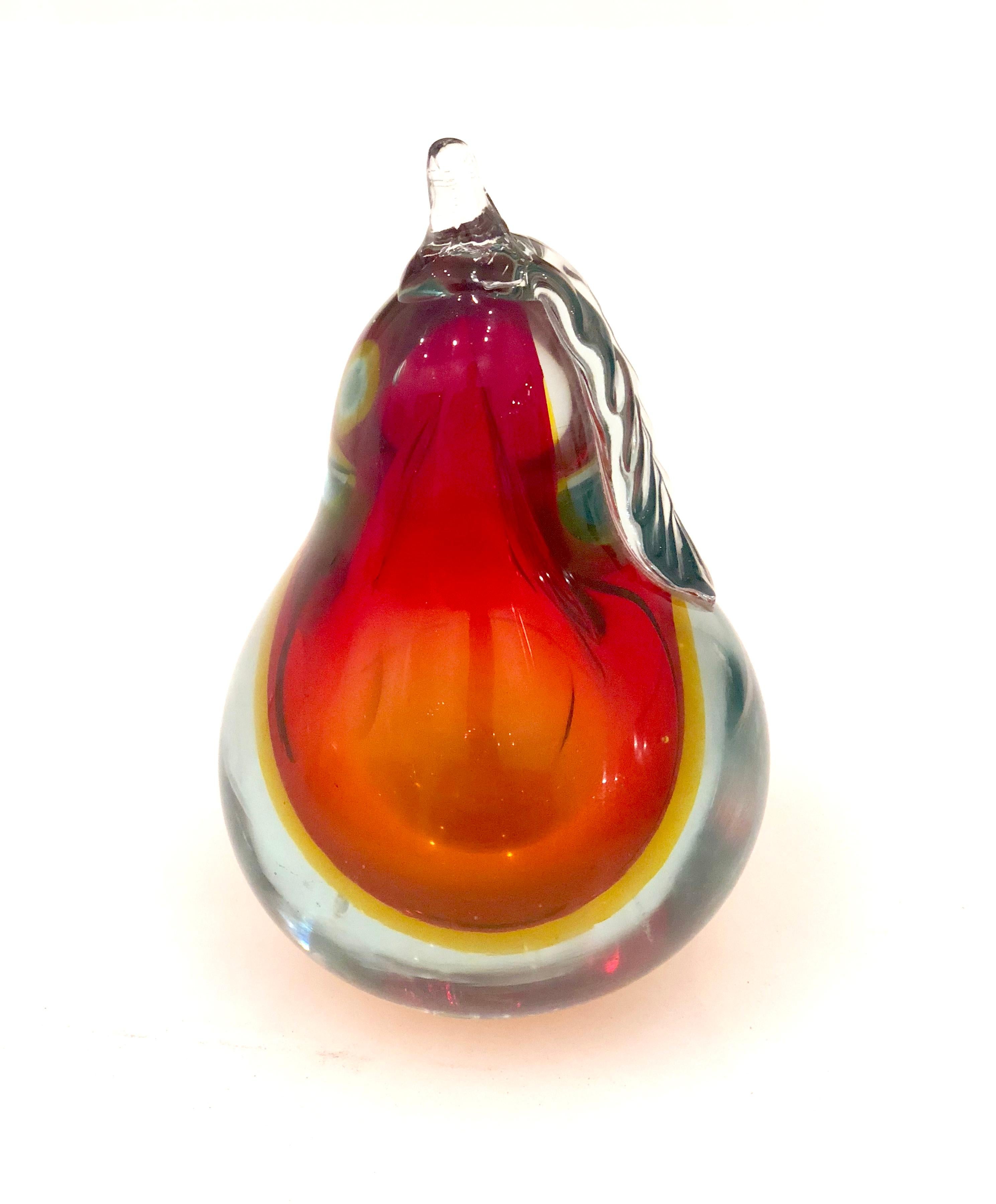 A gorgeous and relatively large Italian Murano art glass pear sculpture, Italy, circa mid-20th century. beautiful colors in excellent condition no chips or cracks can be place on its side its got a flat side also.