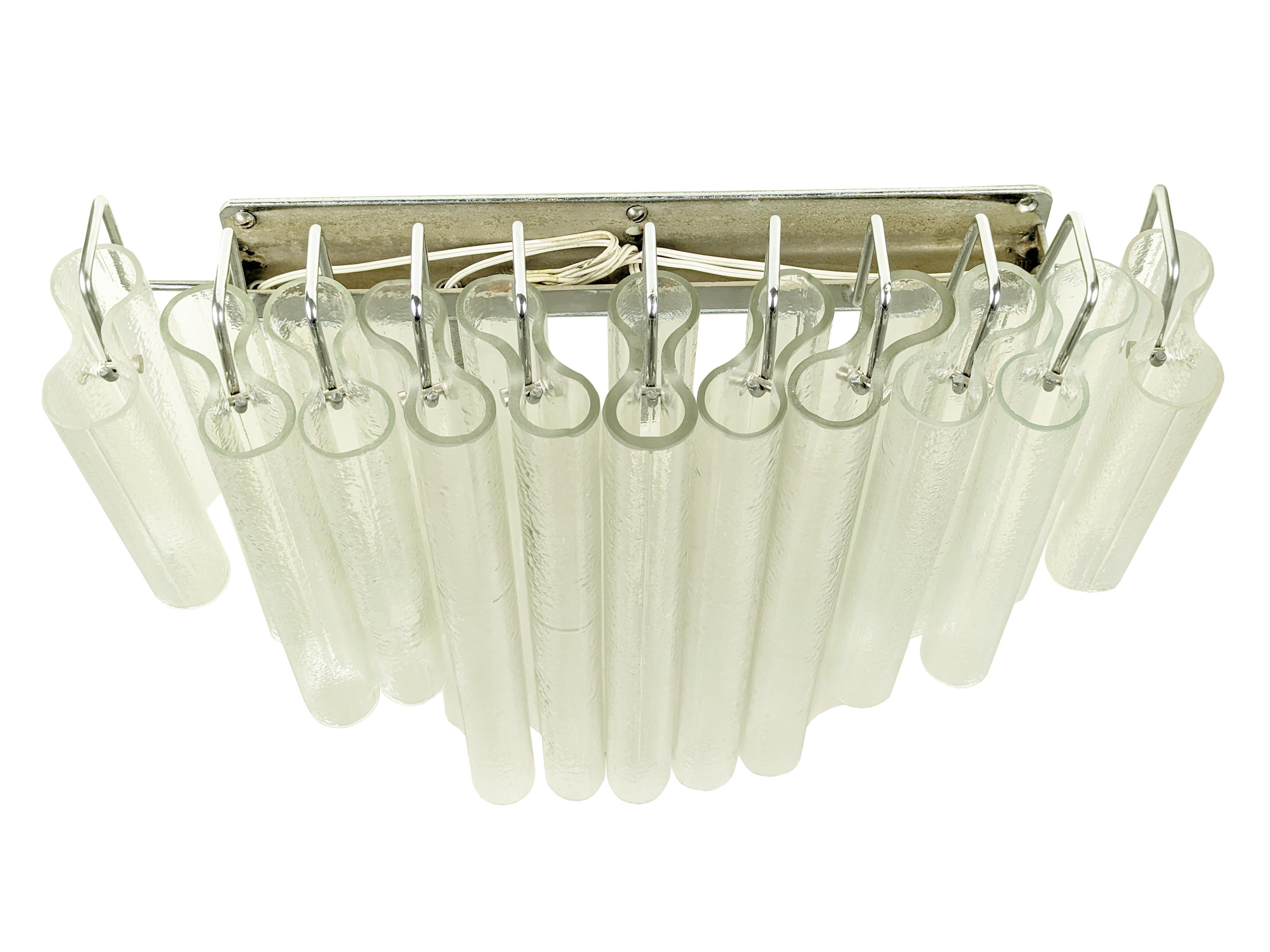 Large sconce made of chrome plated metal structure with 11 clear molded glass 