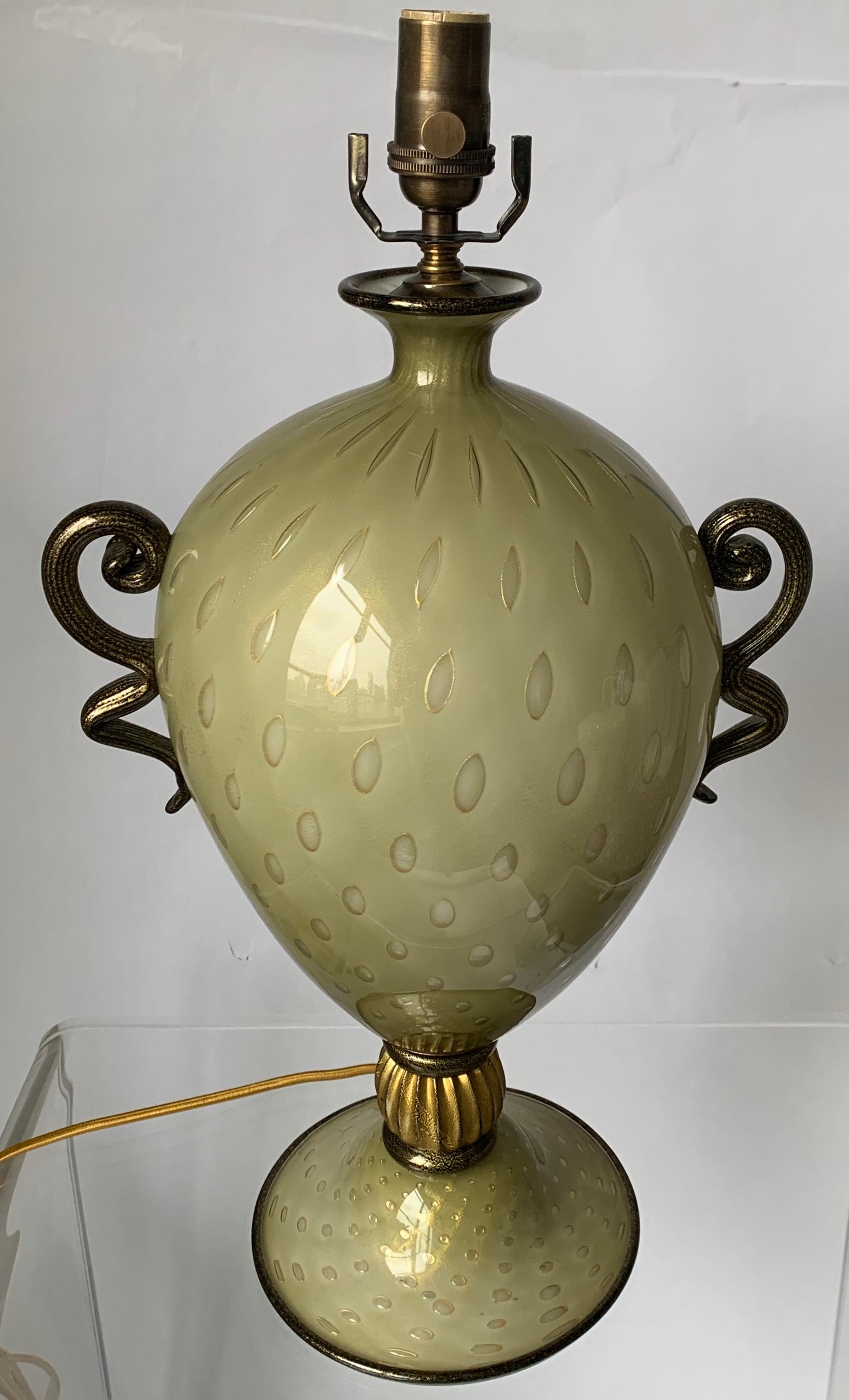 Large curvy Murano glass lamp. Green blown glass with all over bullicante (controlled bubbles) and gold flecked detailing. Black blown glass with gold flecks detailing. Newly rewired with silk cord. Takes one standard bulb (not included). Lampshade