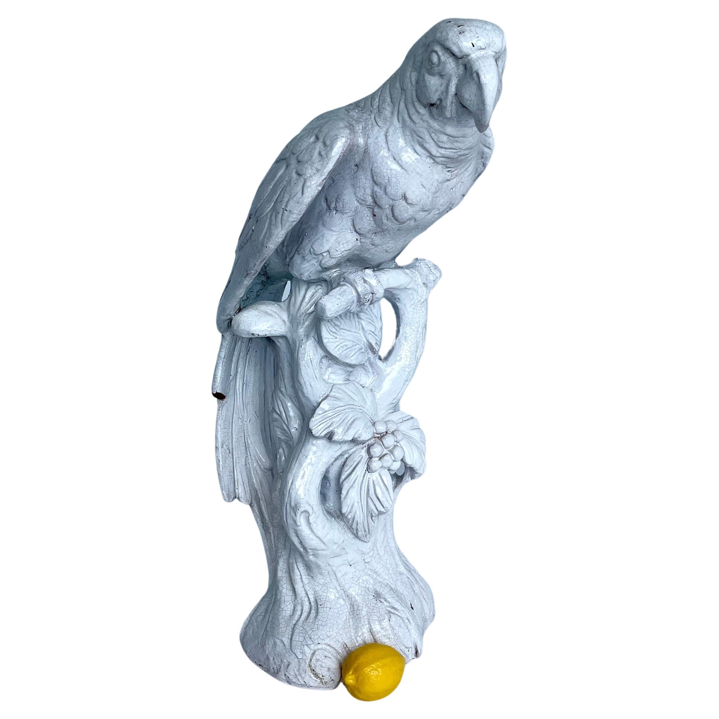 Tall White Porcelain Parrot Sculpture with White Glaze, Italy 1960's

This large life-like parrot is perched on a branch with a faux bois base decorated with leaves. This sculpture would be an exquisite addition to a coffee or side table as well as