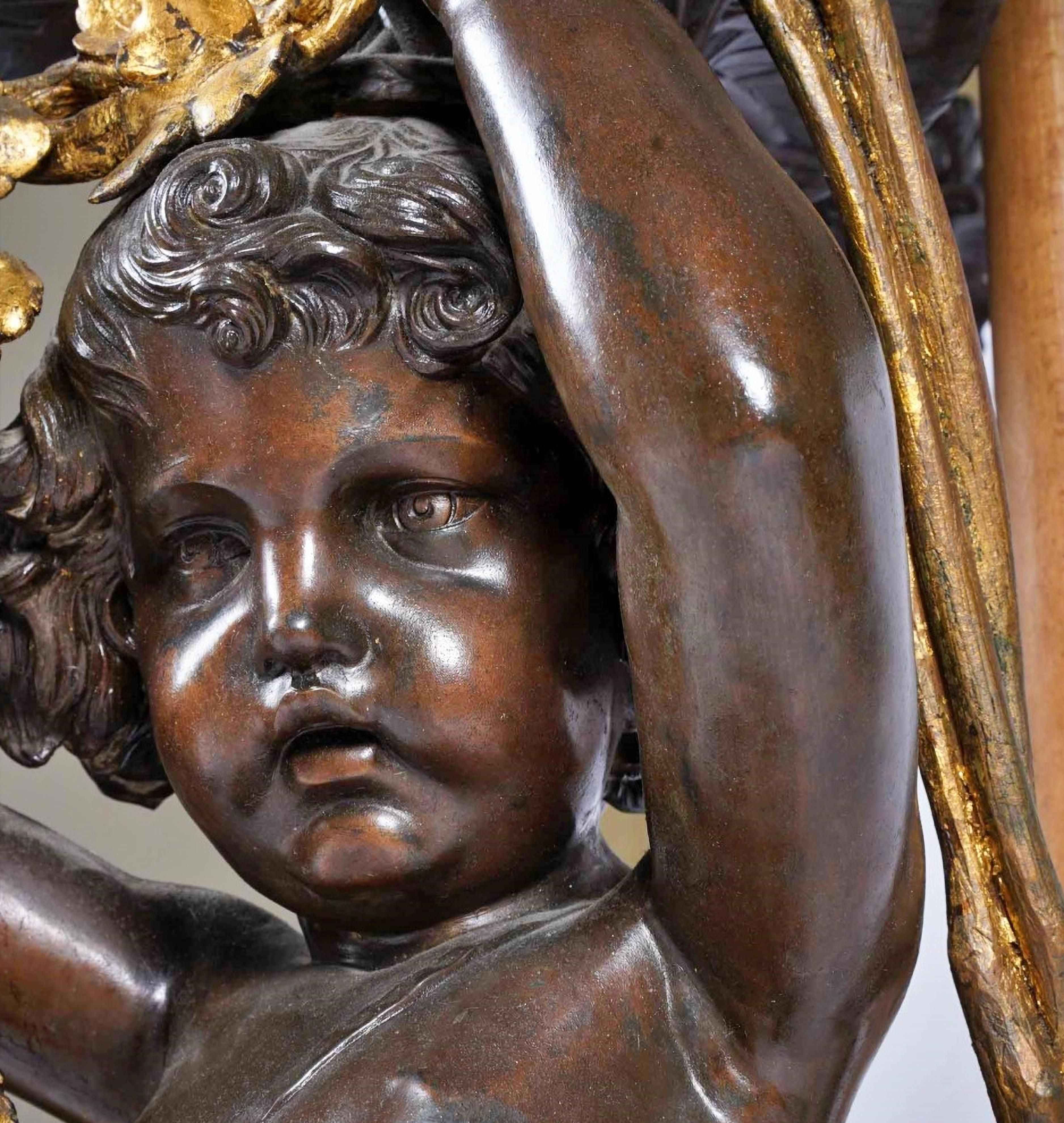 Large Italian Patinated Bronze candelabra
late 19th Century
Stem with child Bacchus in the round surrounded by gilded bronze vine leaves
Some lacks, small restorations
Width 65 - Prof. 65 - Height 151 Cm.