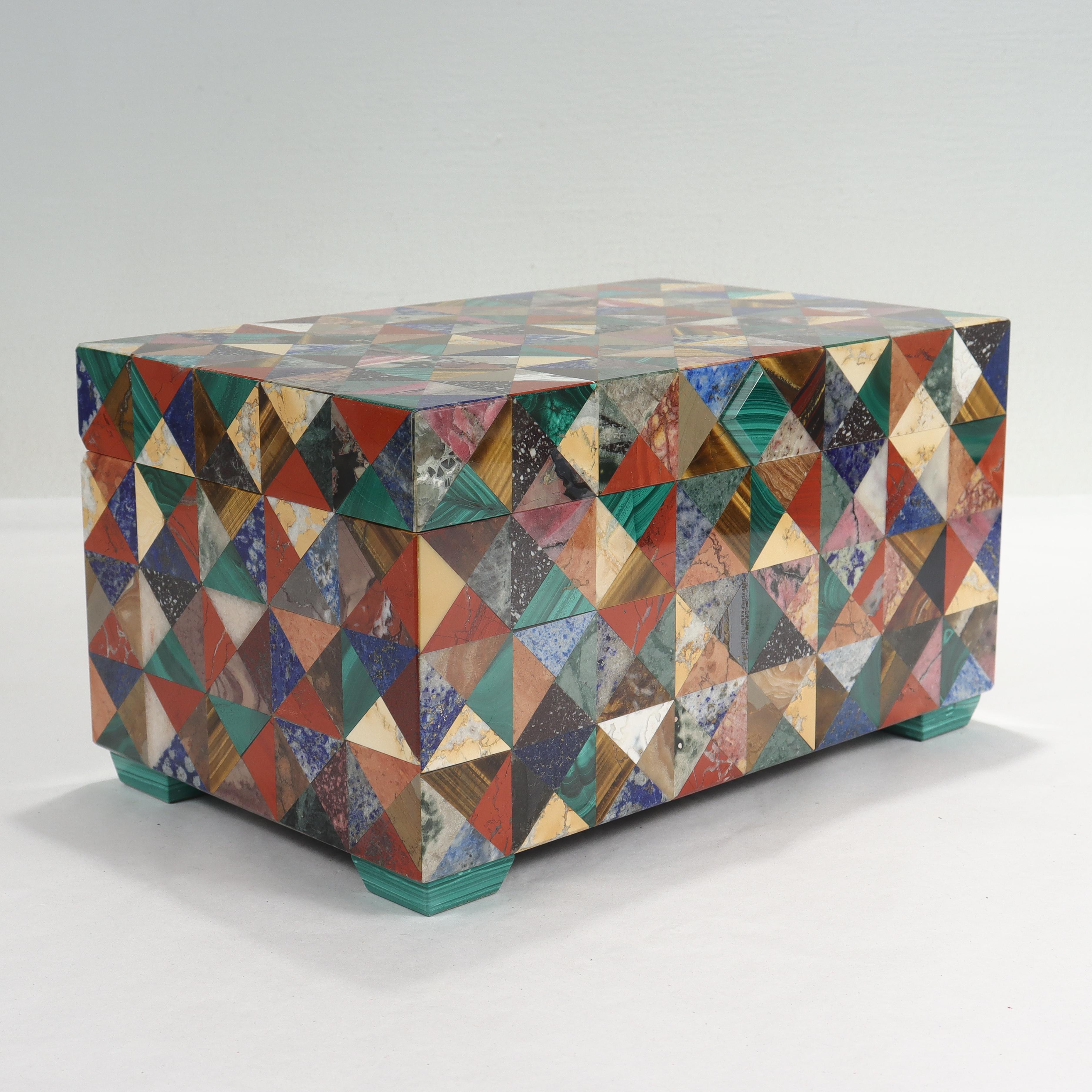 A fine Pietra Dura table box or casket.

By the Raphael Romanelli Company of Florence, Italy.

Comprised of a wide variety of hardstone and gemstone veneers, including malachite, jasper, lapis lazuli, rhodochrosite, and many others.

Of rectangular