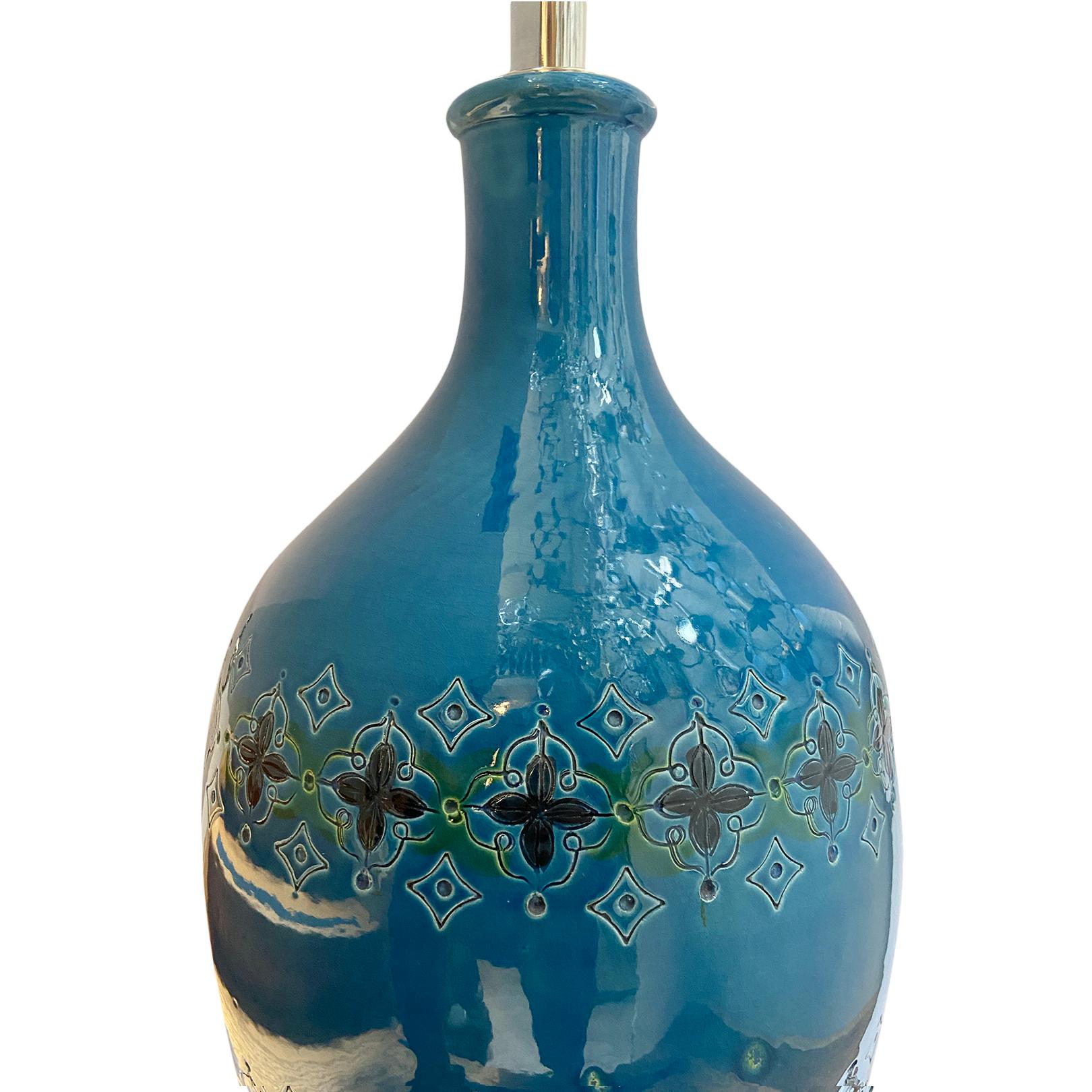 A large circa 1960's Italian blue porcelain lamp with lucite base.

Measurements:
Height of body: 26.5