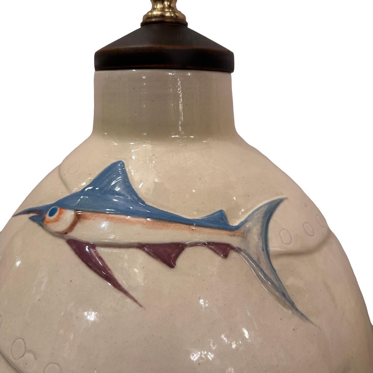 A circa 1950's Italian lamp with fish depictions.

Measurements:
Height of body: 20