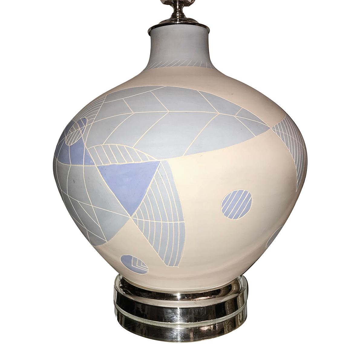 A large circa 1960's Italian ceramic table lamp with white and blue tones and nickel-plated base.

Measurements:
Height of body: 17.5