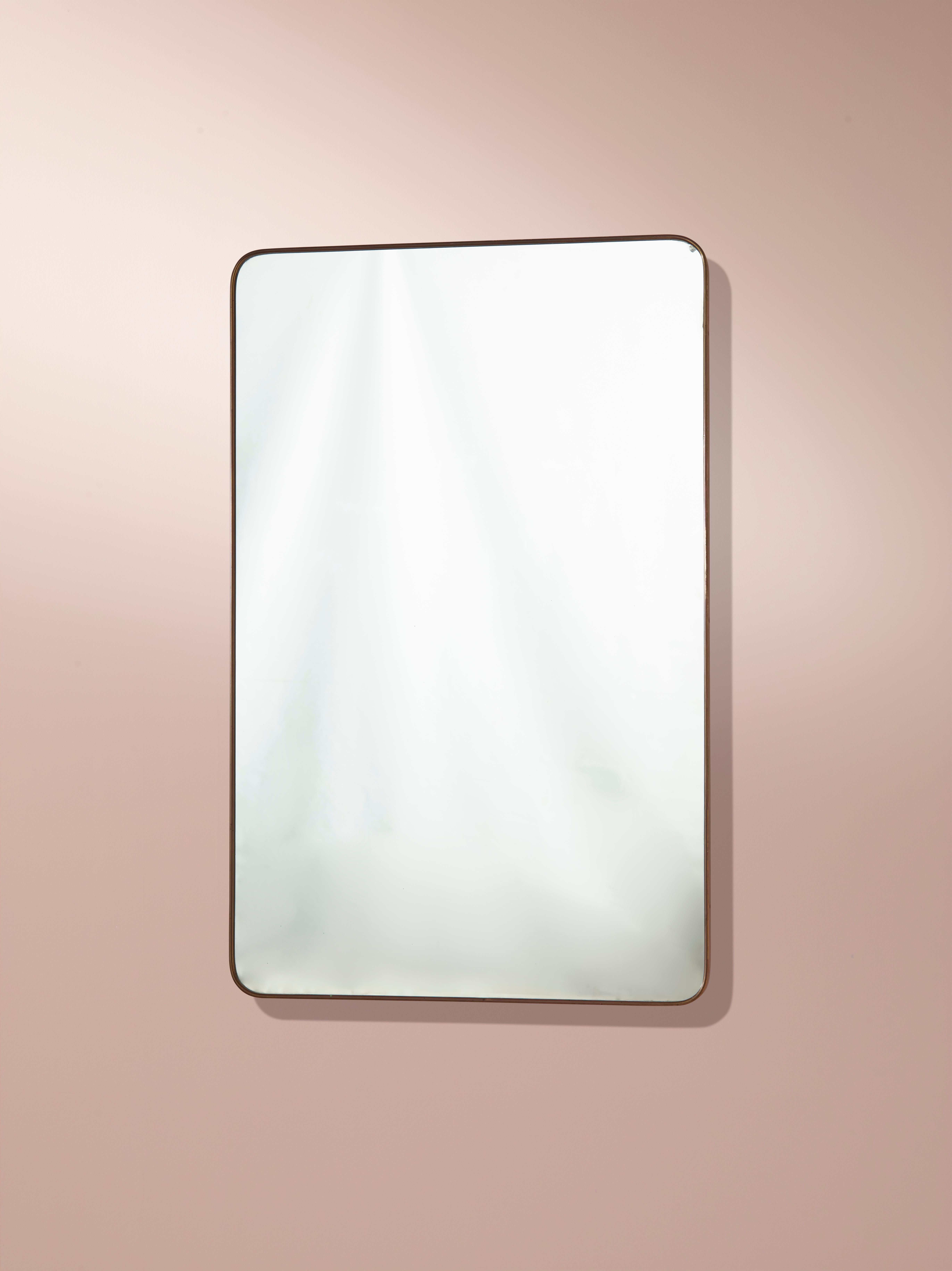An Italian large brass wall mirror from the 1950s. With a rectangular shape, with a simple yet sophisticated design, it is a beautiful piece of Italian design from the 1950s.

The dimensions of the mirror are 111cm in height, 70.5cm in width, and