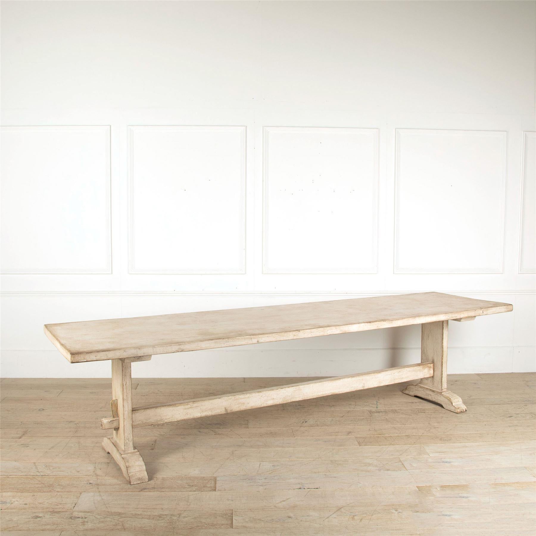 A large painted pine refectory/dining trestle table, 20th century.