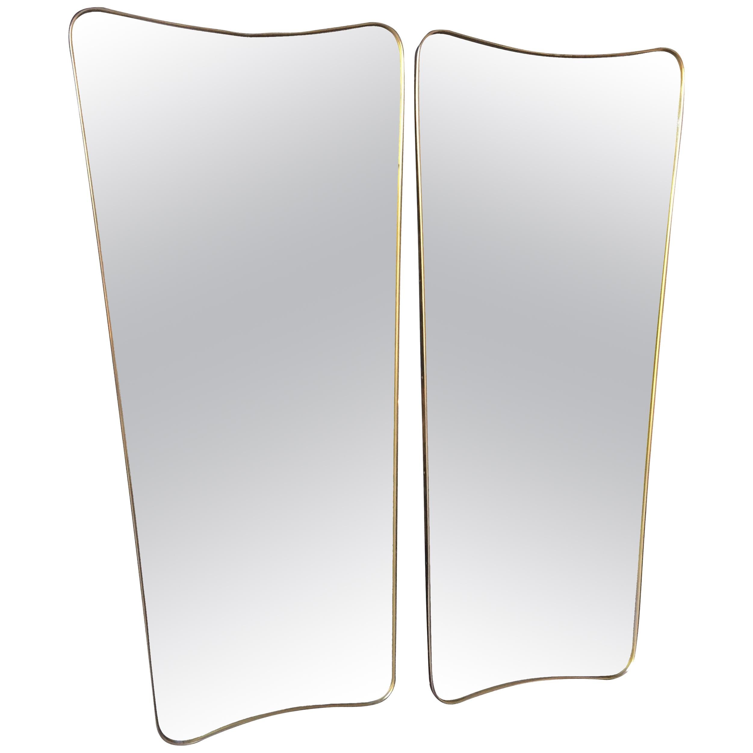 AN ITALIAN SHIELD MIRROR WITH BRASS SURROUND IN THE STYLE OF GIO PONTI WITH CURVED AND TAPERED FRAME.

THESE ARE MADE TO ORDER IN ITALY AND TAKE 4-6 WEEKS TO MAKE AND DELIVER TO LONDON.

TWO OTHER SIZES ARE 91CM HIGH and 145 CM HIGH.

   