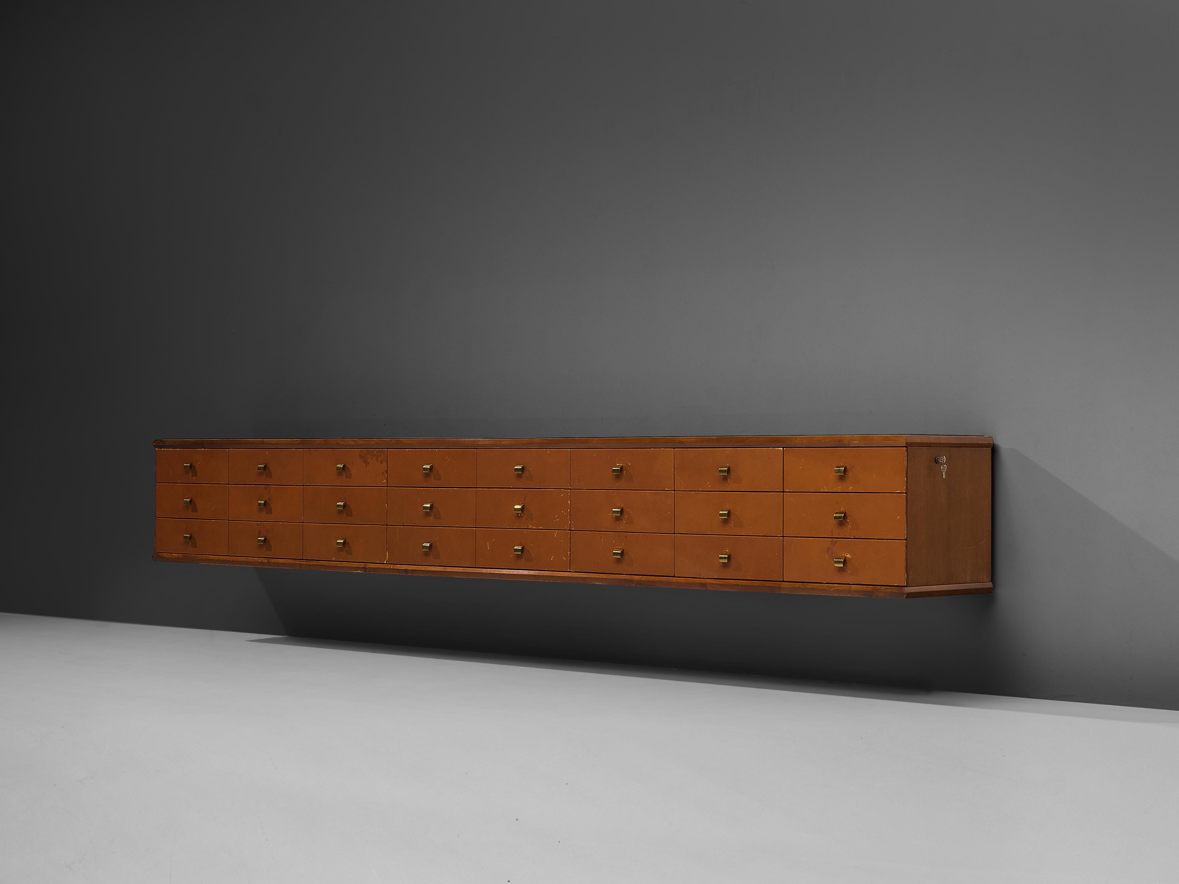 Sideboard, leather, brass, glass, walnut, Italy, 1960s

Large wall-mounted sideboard with drawers. This 11 ft. sideboard is manufactured in walnut wood and has a black glass top. The key feature are the many drawers. Even though they all seem to