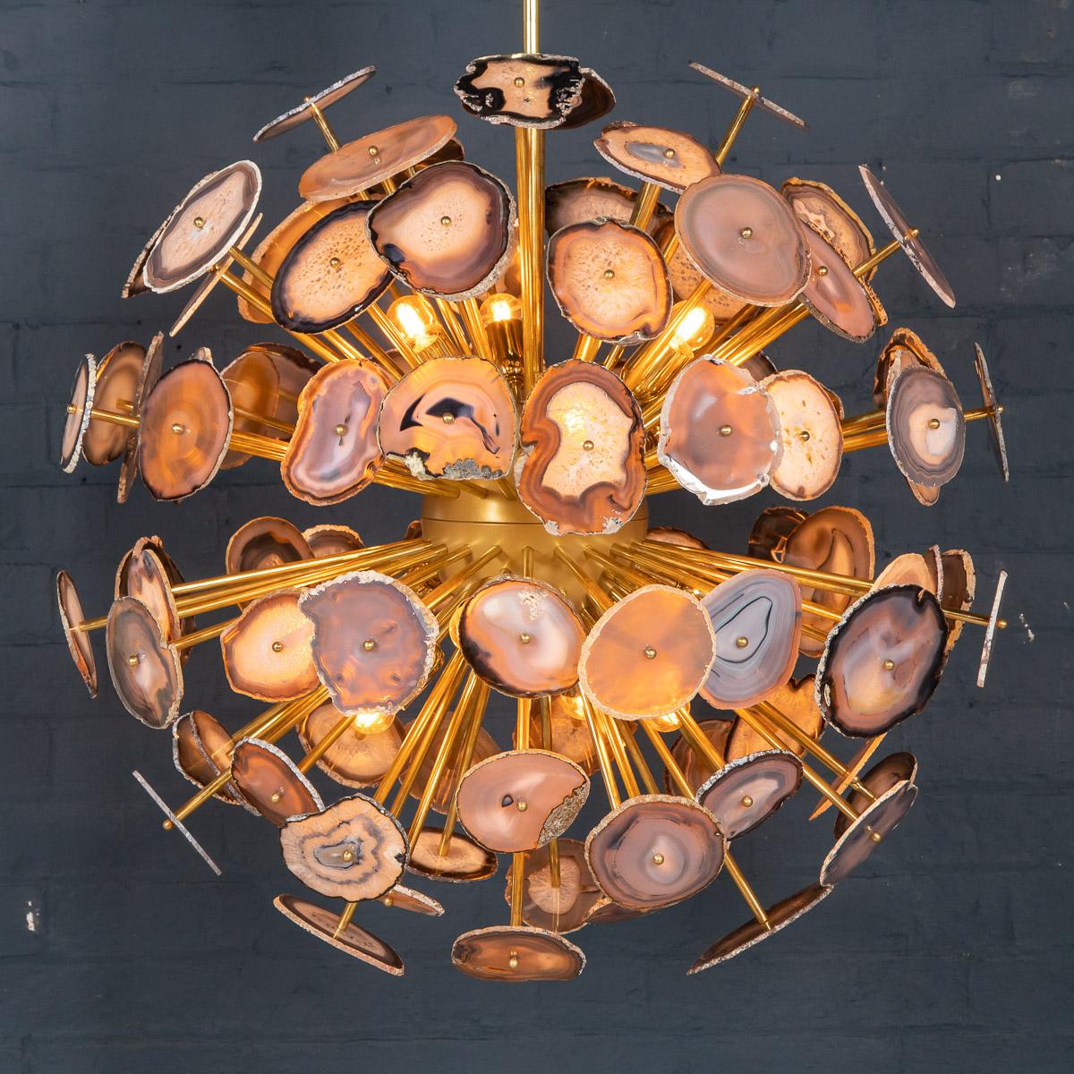A very stylish and unusual “Sputnik” chandelier made out of sections of Brazilian agate. The structure itself is made out of brass and is of exceptional quality. As a piece of architectural design inspired by nature, it is a striking addition to any